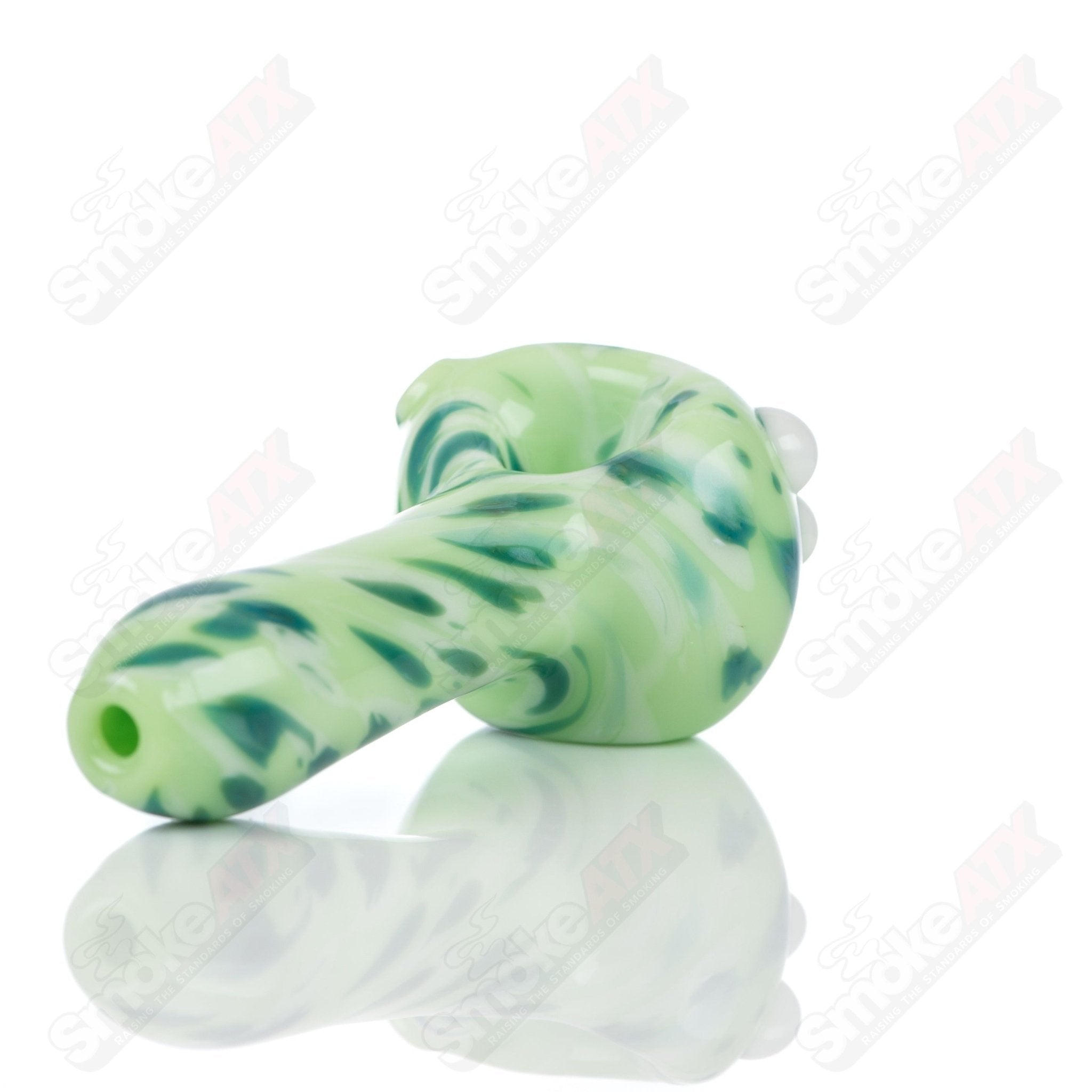 Colorful Kiwi splatter glass spoon pipe by Adventures In Glass Blowing, showcasing intricate glass blowing craftsmanship.