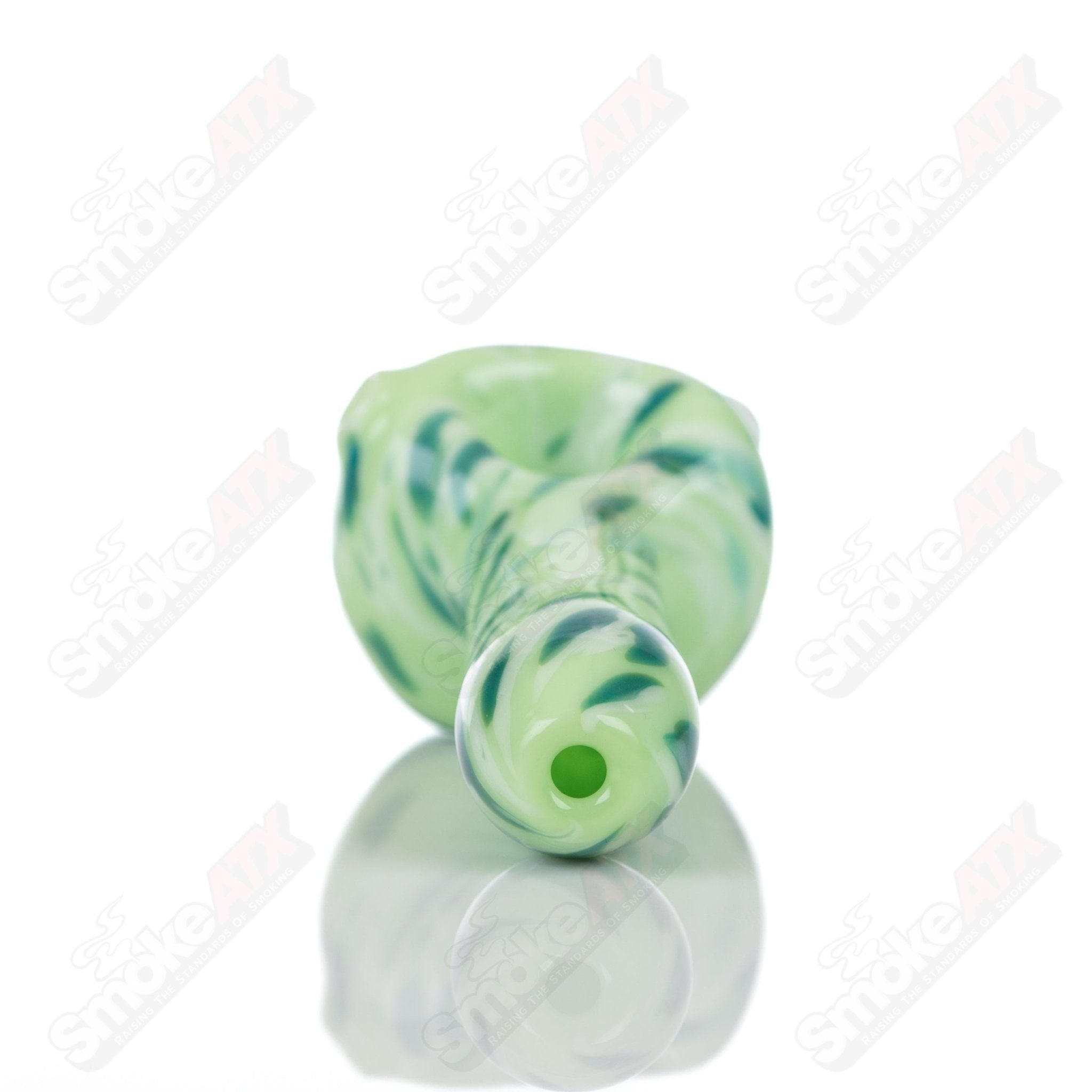 Colorful kiwi splatter glass spoon pipe by Adventures In Glass Blowing, showcasing intricate glass-blown design and vibrant patterns.