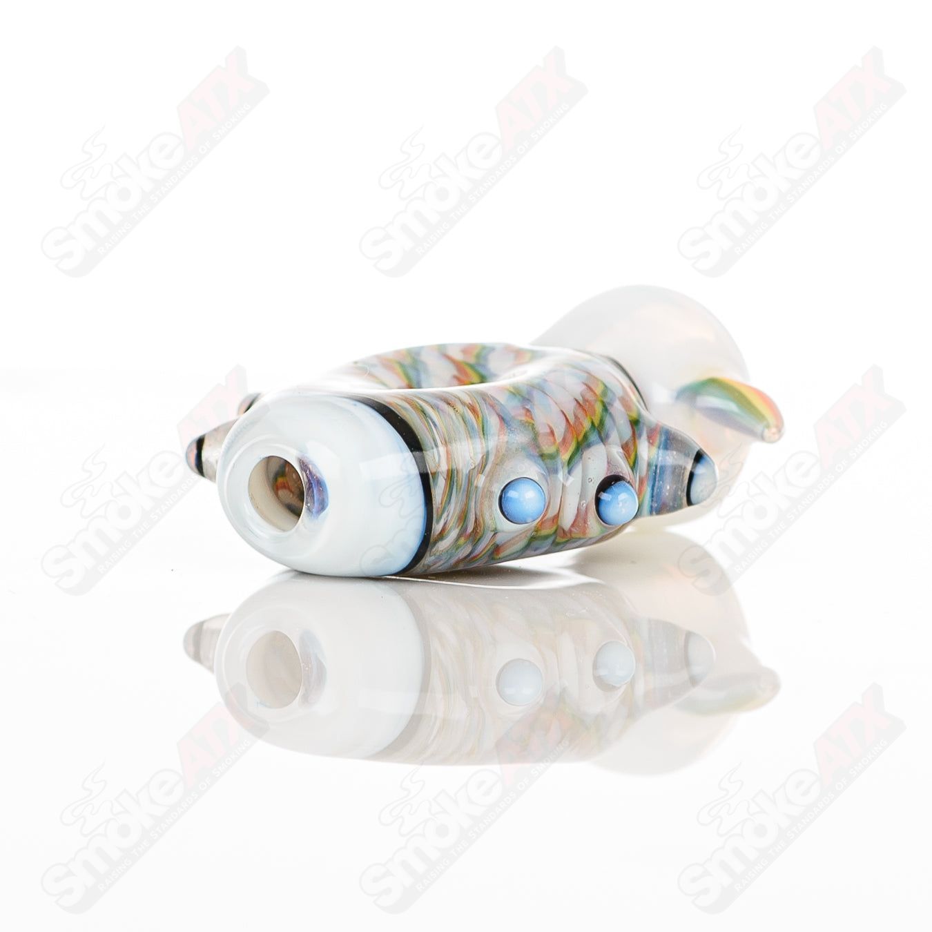 Large glass donut chillum by Baby Dabs, designed for baby dabs, featuring a colorful donut shape and clear glass construction.