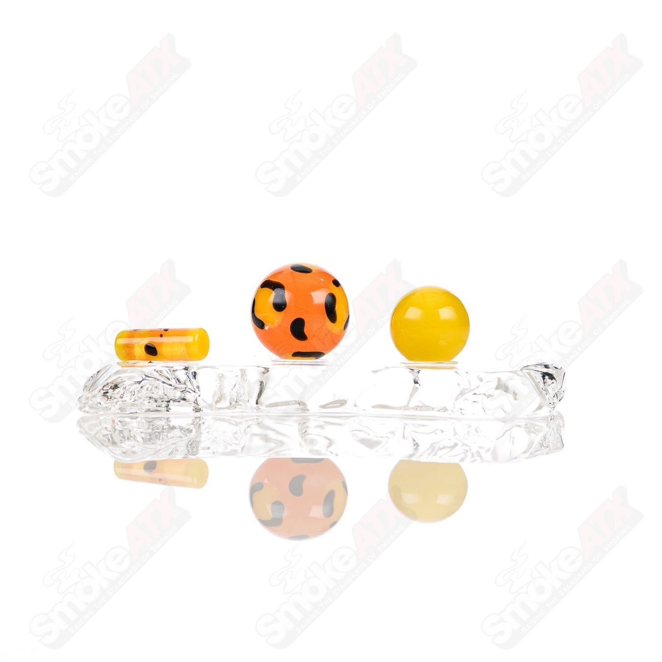 Three leopard-themed glass slurper sets from Adventures In Glass Blowing, featuring detailed glass designs and vibrant animal patterns.