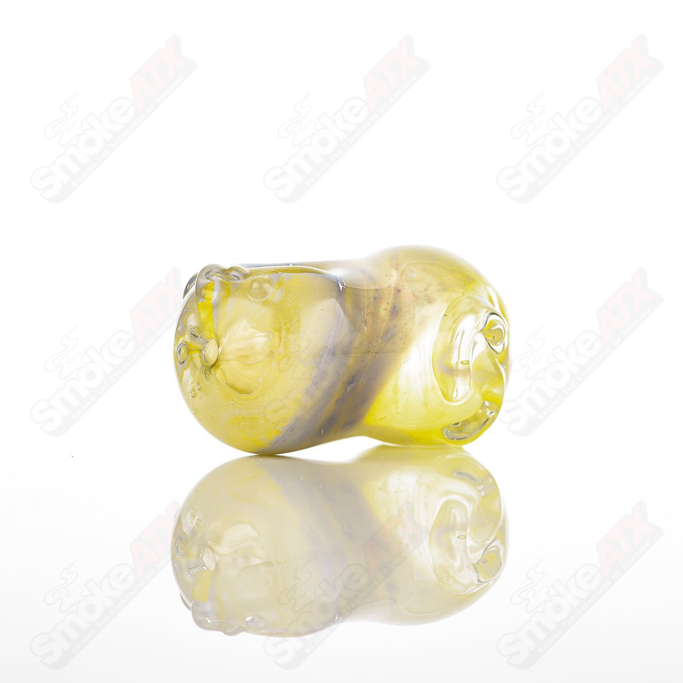 Clear glass pipe called the #30 Bean Spoon by Nobody, featuring a smooth, rounded bean-shaped bowl and sleek design.