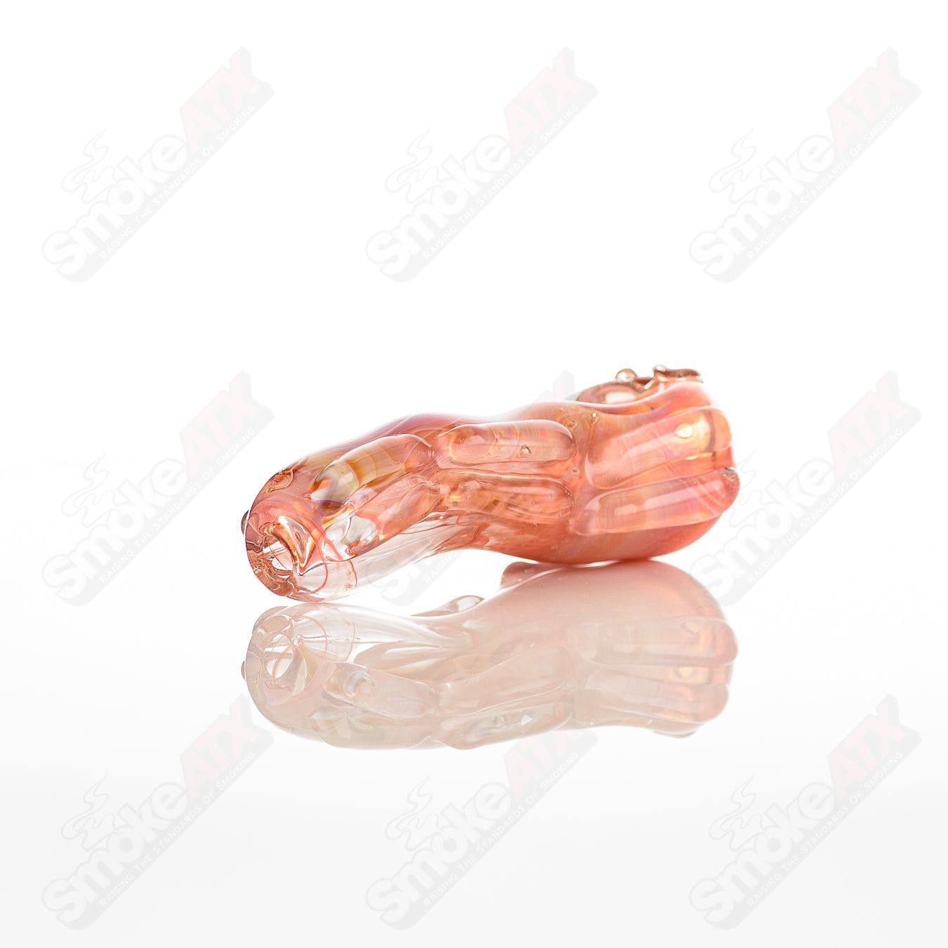 Clear glass spoon pipe with a smooth shape, designed by Nobody, for smoking or herbal use.