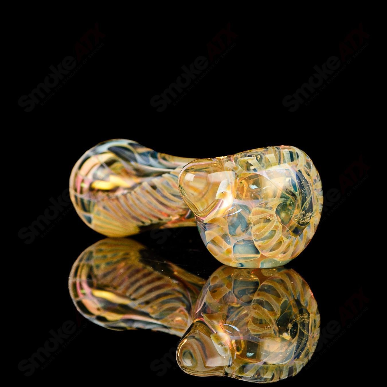 Texas Hot Glass spoon chillum in clear glass, featuring a smooth, rounded shape with a small bowl for smoking purposes.