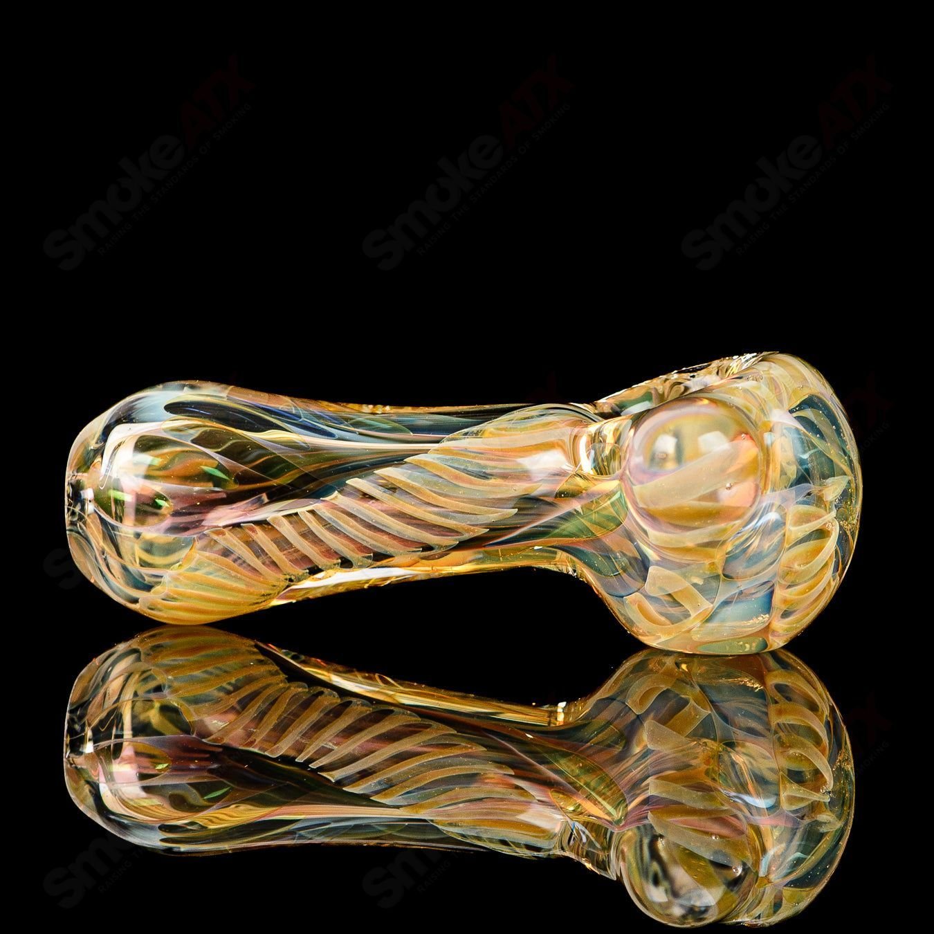 Texas Hot Glass Spoon Chillum, clear glass smoking pipe with a smooth, rounded bowl and elongated stem for easy handling.