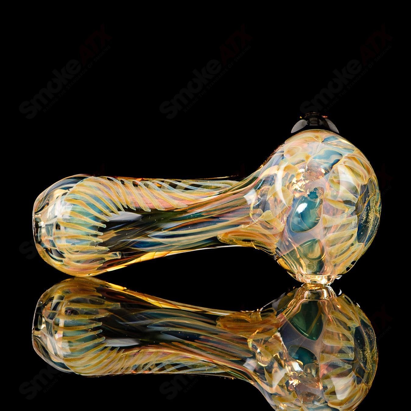 Texas Hot Glass Spoon Chillum, clear glass smoking pipe with a smooth, rounded bowl and elongated mouthpiece.