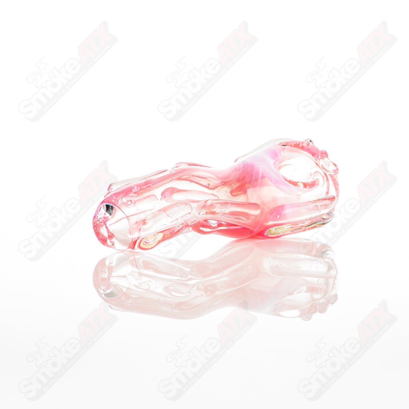 Glass pipe in the shape of a spoon, made by Nobody, featuring clear glass with a smooth, rounded bowl and a long stem.