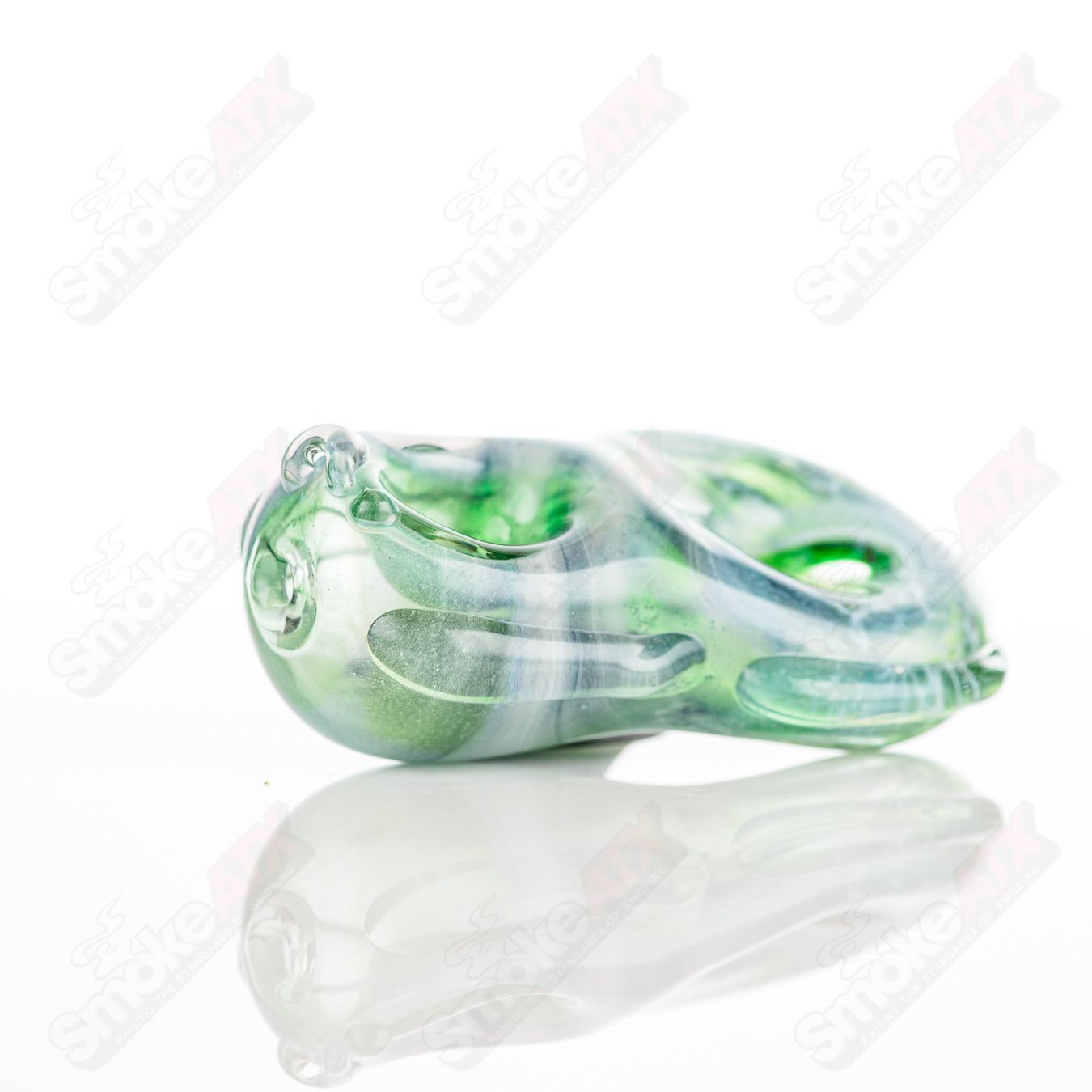 Glass donut chillum pipe by Nobody, featuring a colorful goddess design and smooth glass construction.