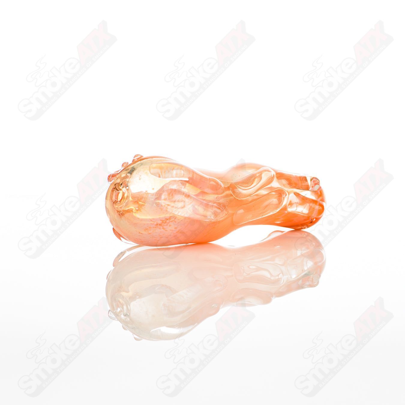 Glass pipe called Spoon Glass by Nobody, clear glass with a rounded bowl and smooth stem, designed for smoking.