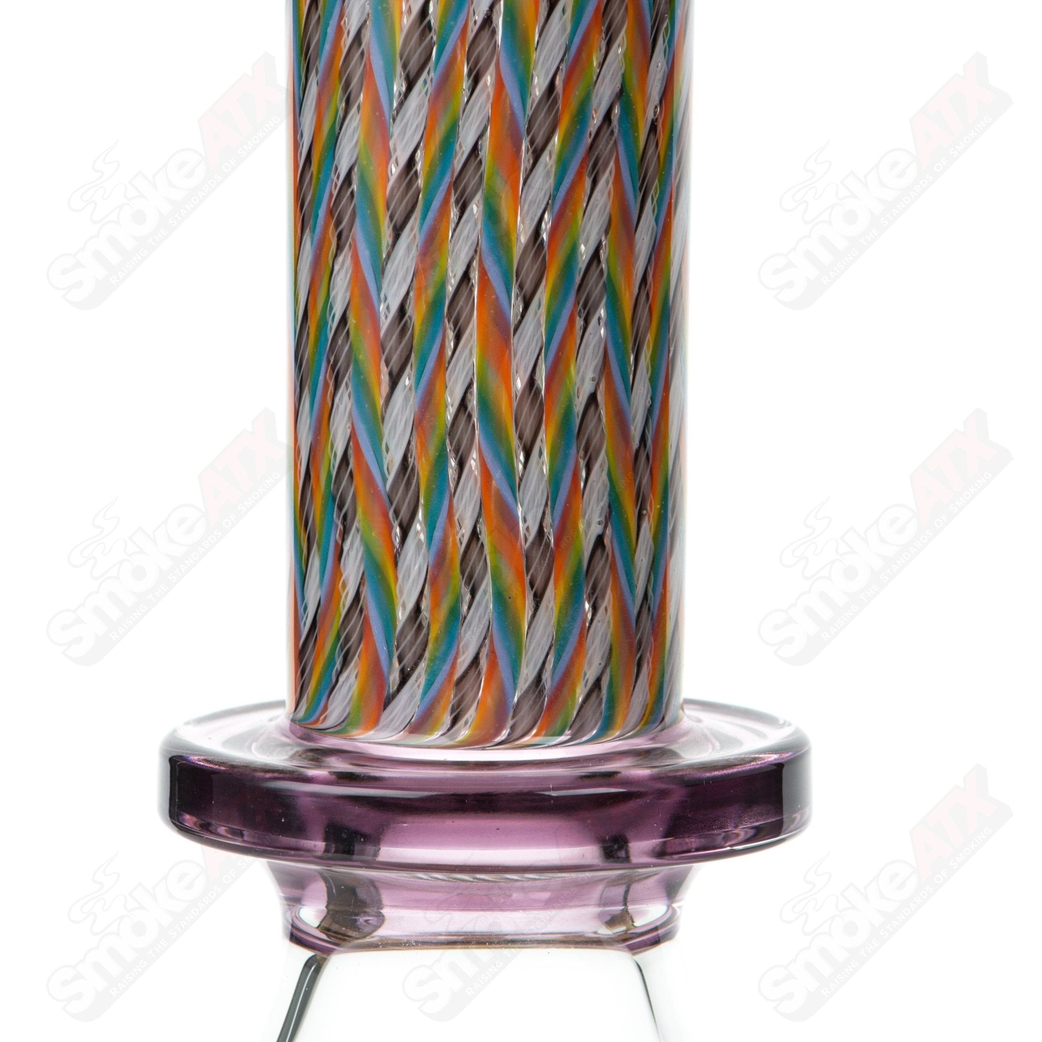 Four Stephan Peirce Glass x Harold Cooney beakers with colorful designs and clear glass construction, displayed on a plain background.