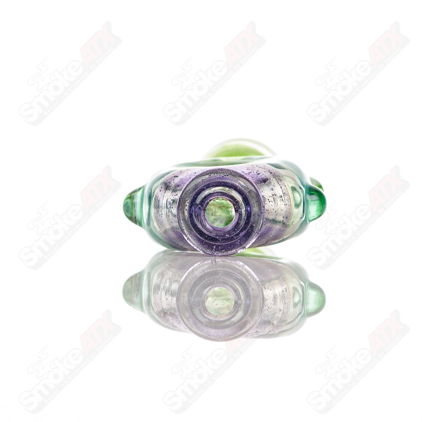 Large donut-shaped glass chillum by Baby Dabs, designed for baby dabs, with a colorful, textured glass surface and compact size.