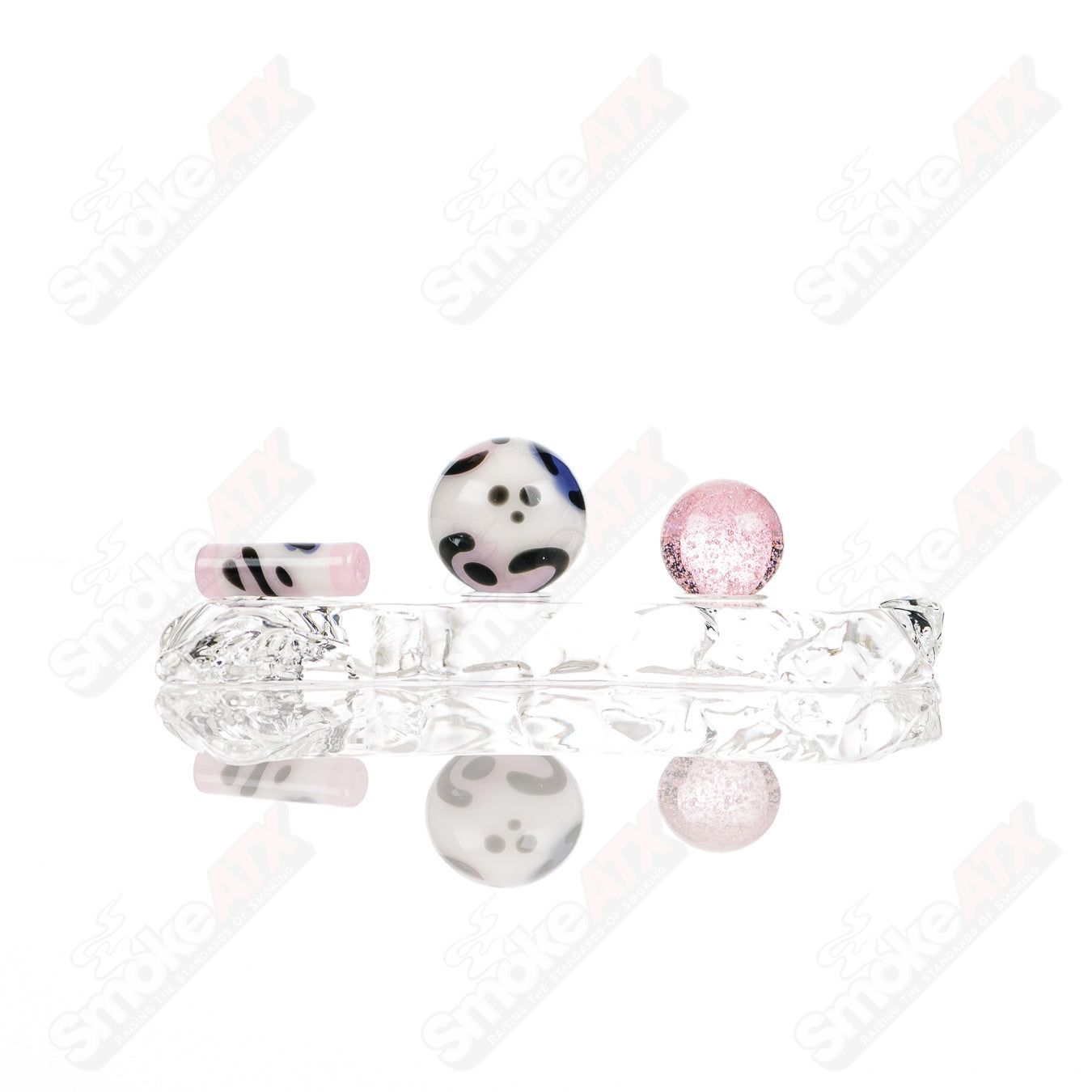 Four leopard-themed glass slurper sets from Adventures In Glass Blowing, featuring intricate designs and colorful glasswork.