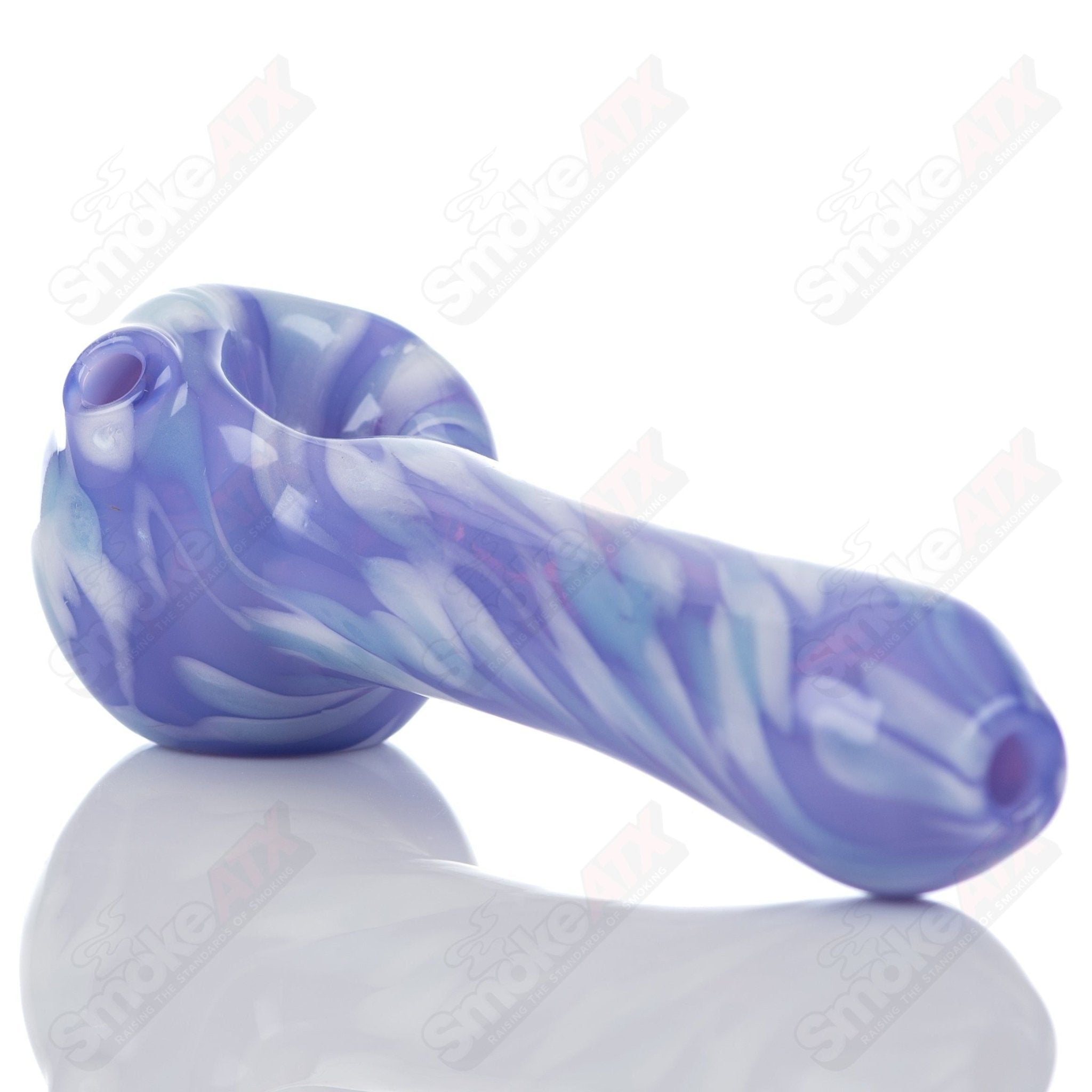 Purple splatter glass spoon pipe from Adventures In Glass Blowing, featuring a detailed, colorful design for smoking enjoyment.