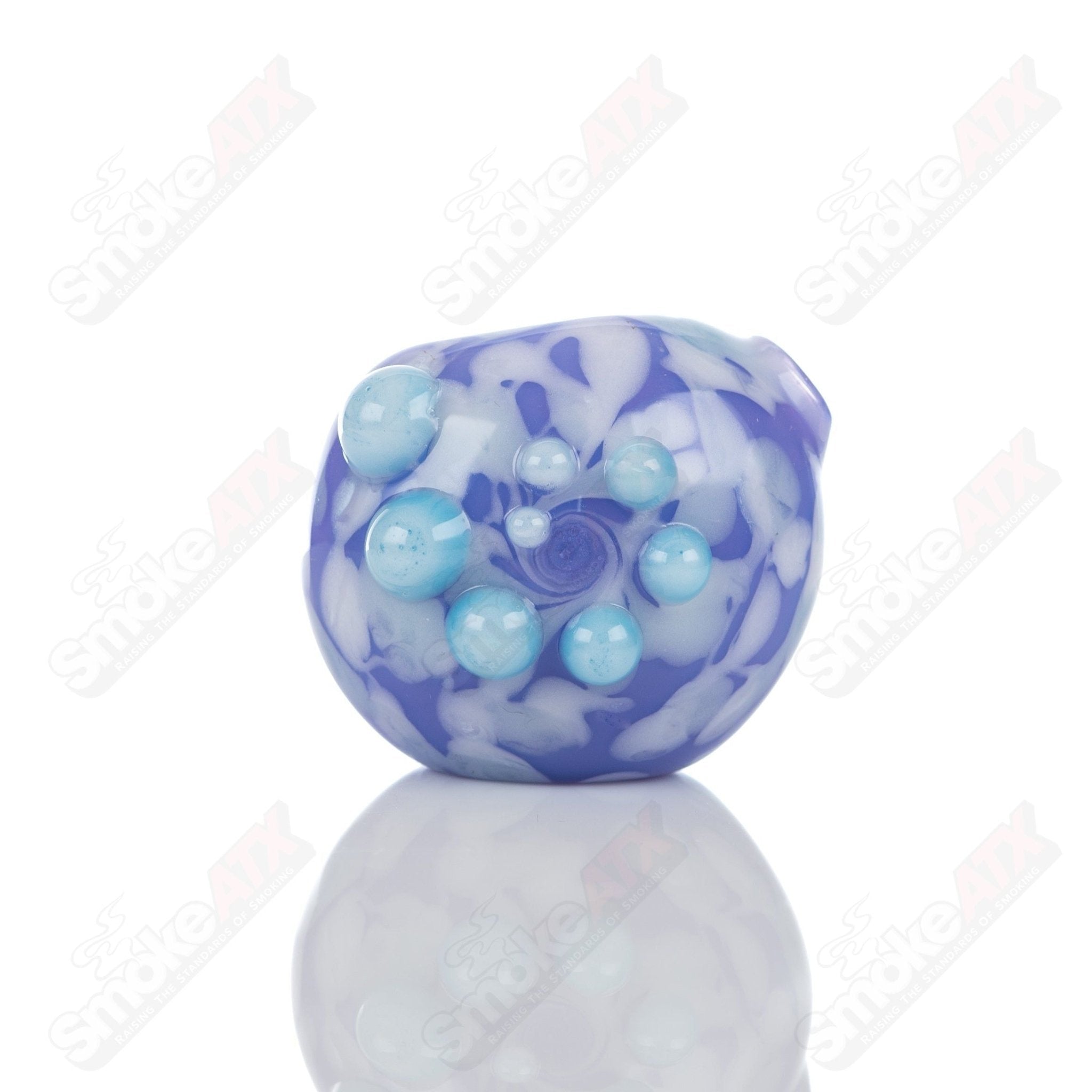 Purple splatter glass spoon pipe by Adventures In Glass Blowing, featuring a colorful artful design and smooth glass craftsmanship.