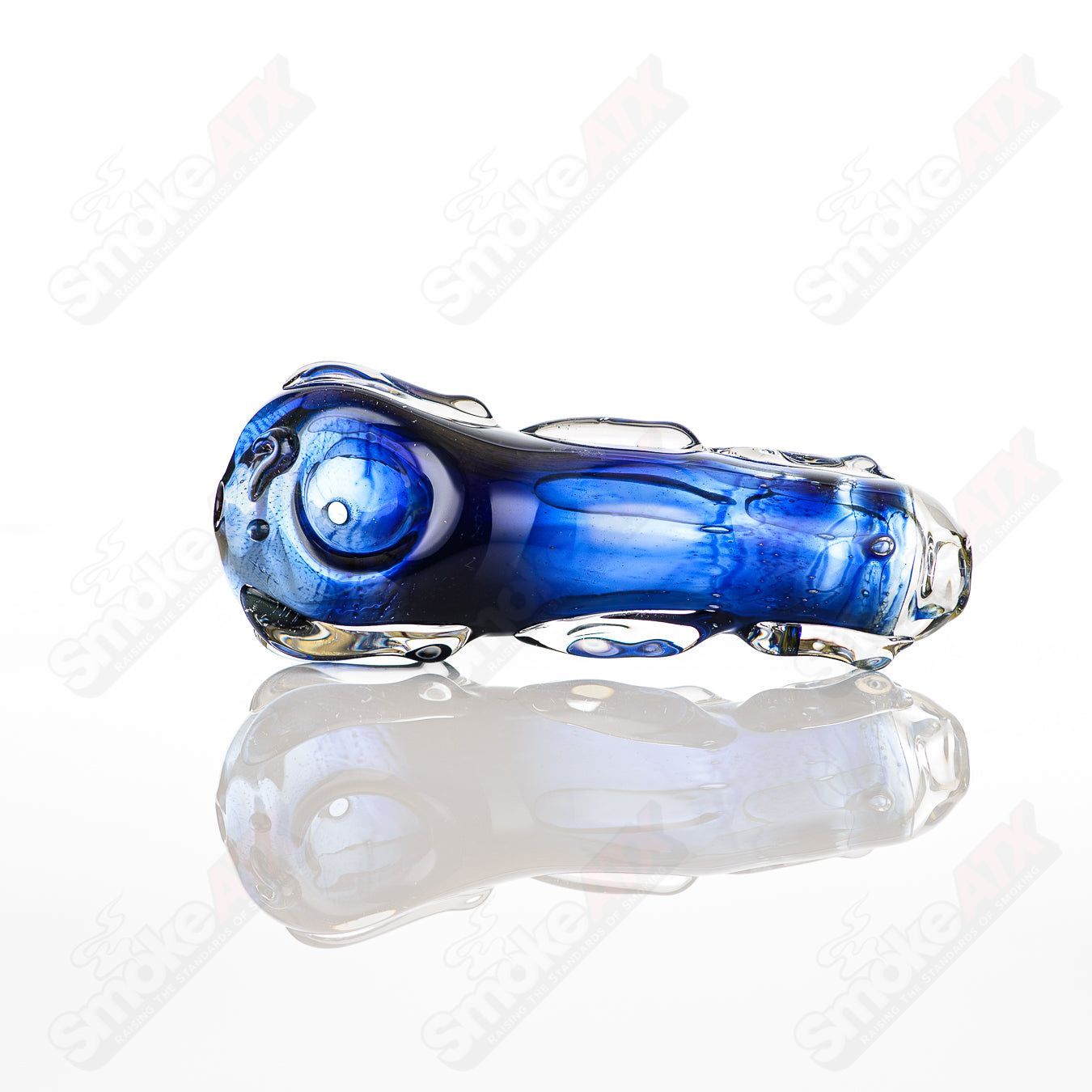 Clear glass spoon pipe by Nobody, featuring a smooth, rounded bowl and sleek design for smoking or vaporizing.