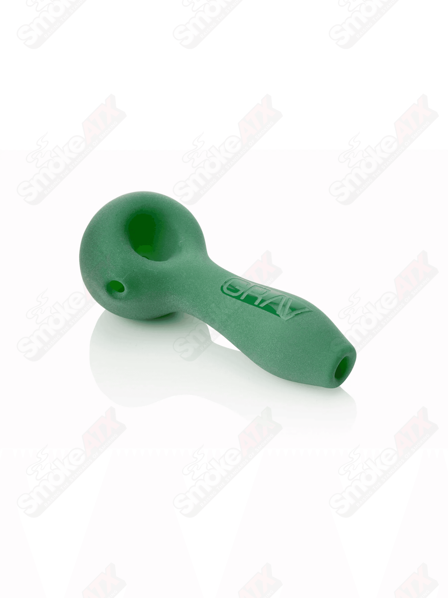 Green sandblasted glass spoon pipe by Grav, 4 inches tall, with textured finish and ergonomic design for smoking.
