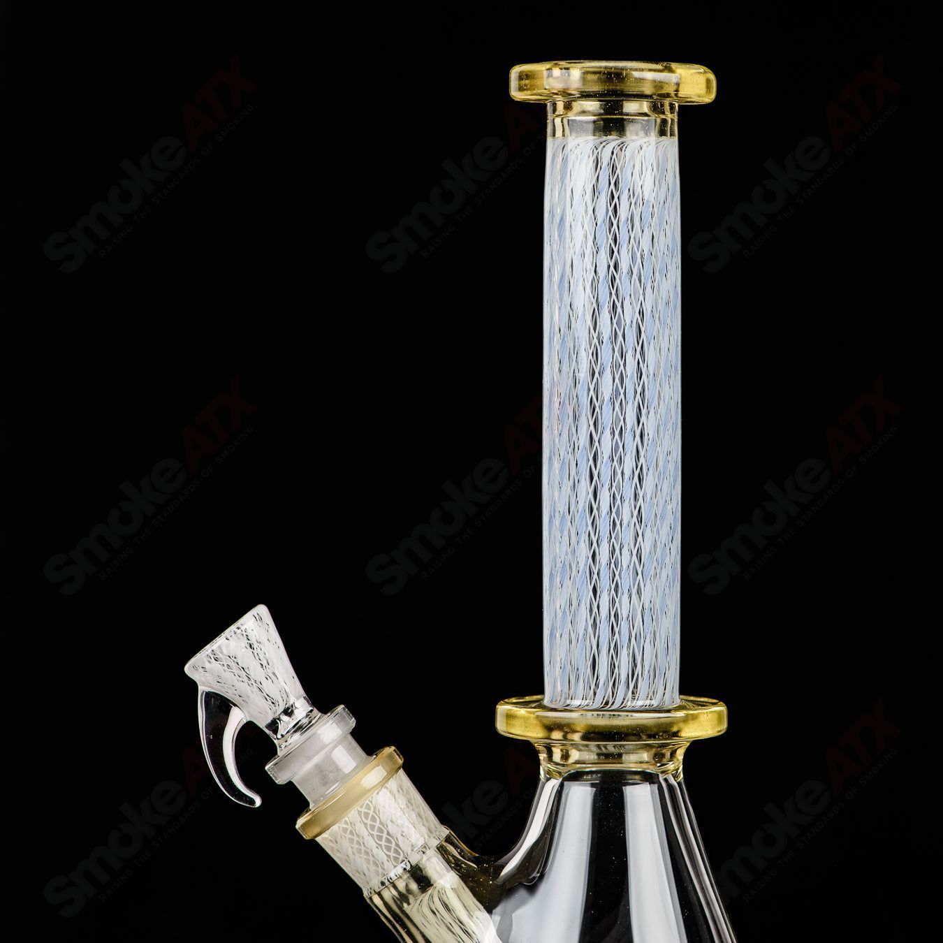 Clear glass beaker labeled "#5 Beaker SPG x Harold Cooney" by Steven Pierce Glass x Harold Cooney, with a cylindrical shape and measuring markings.