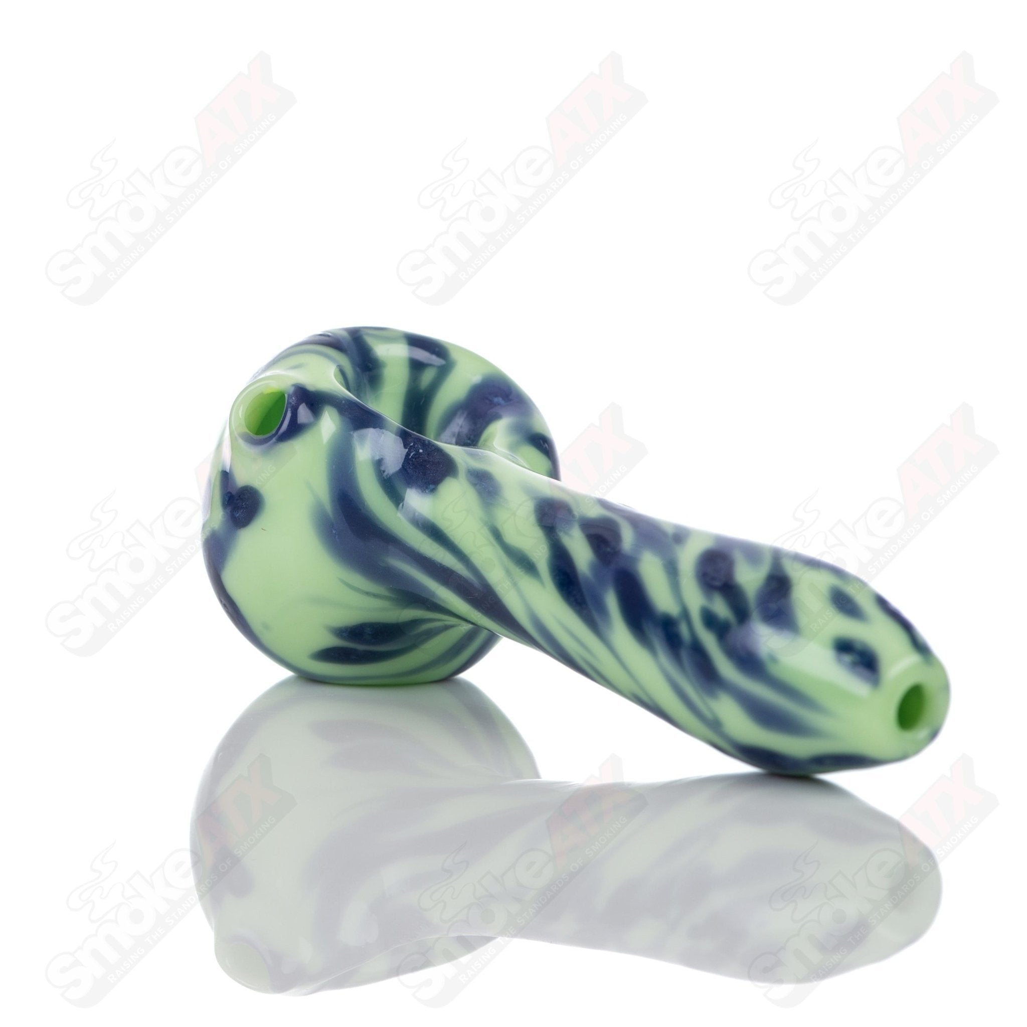 Colorful Kiwi splatter glass spoon pipe by Adventures In Glass Blowing, featuring intricate design and smooth glass finish.