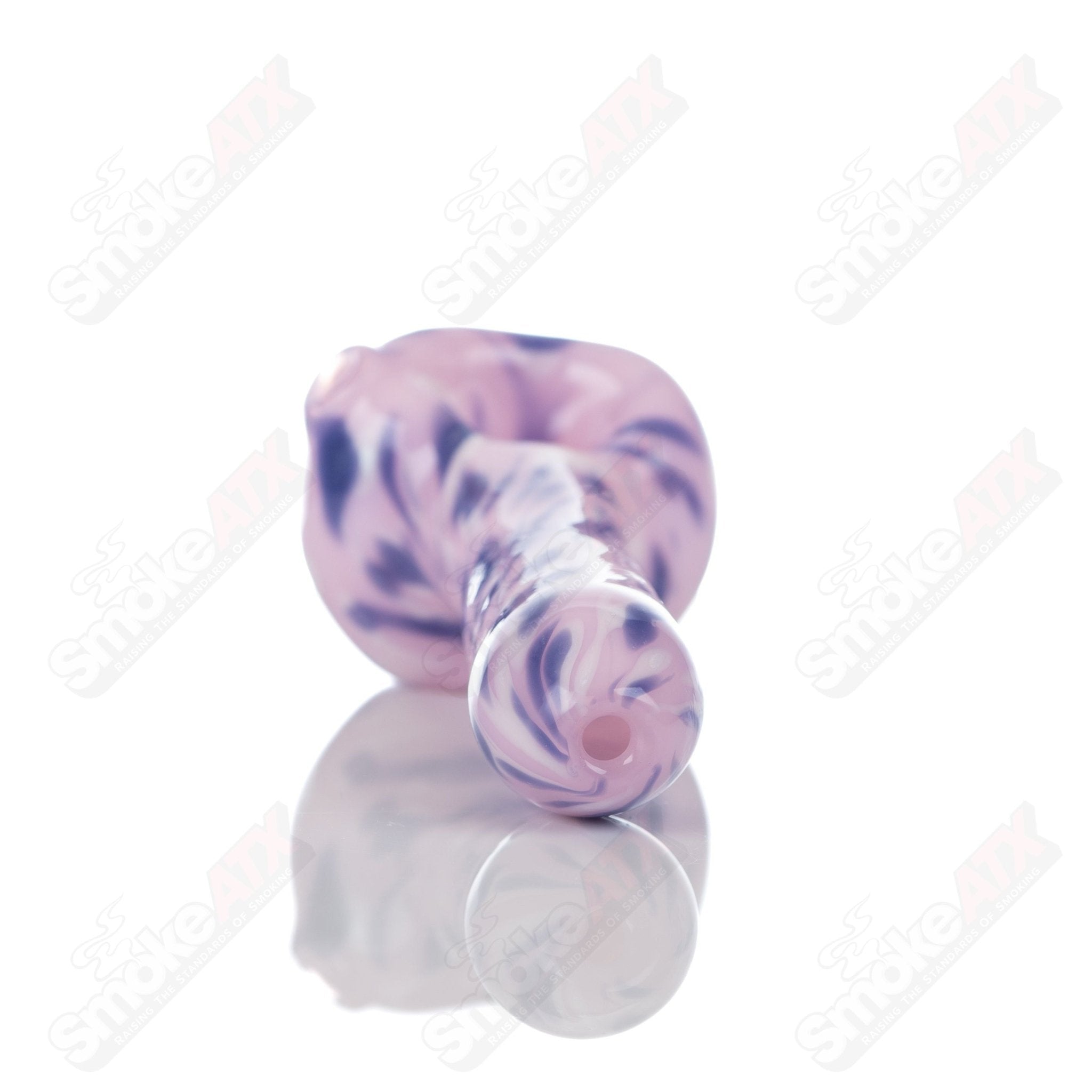 Pink splatter glass spoon pipe by Adventures In Glass Blowing, featuring a colorful design and smooth mouthpiece.