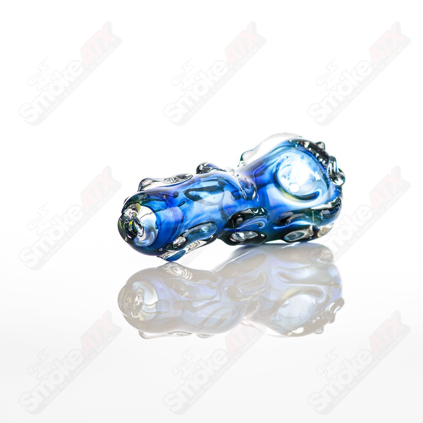 Glass pipe called #58 Spoon by Nobody, clear glass with smooth rounded bowl and straight stem, designed for smoking.