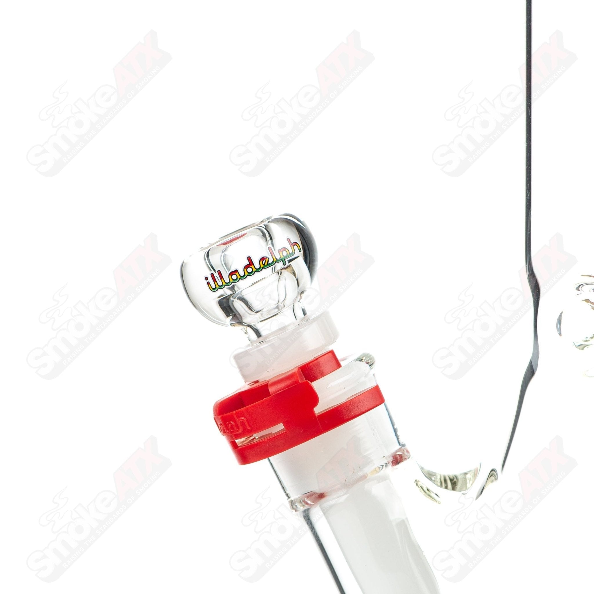 Rasta-colored 5mm glass beaker bong by Illadelph, featuring a medium size with vibrant Rasta design and clear glass construction.