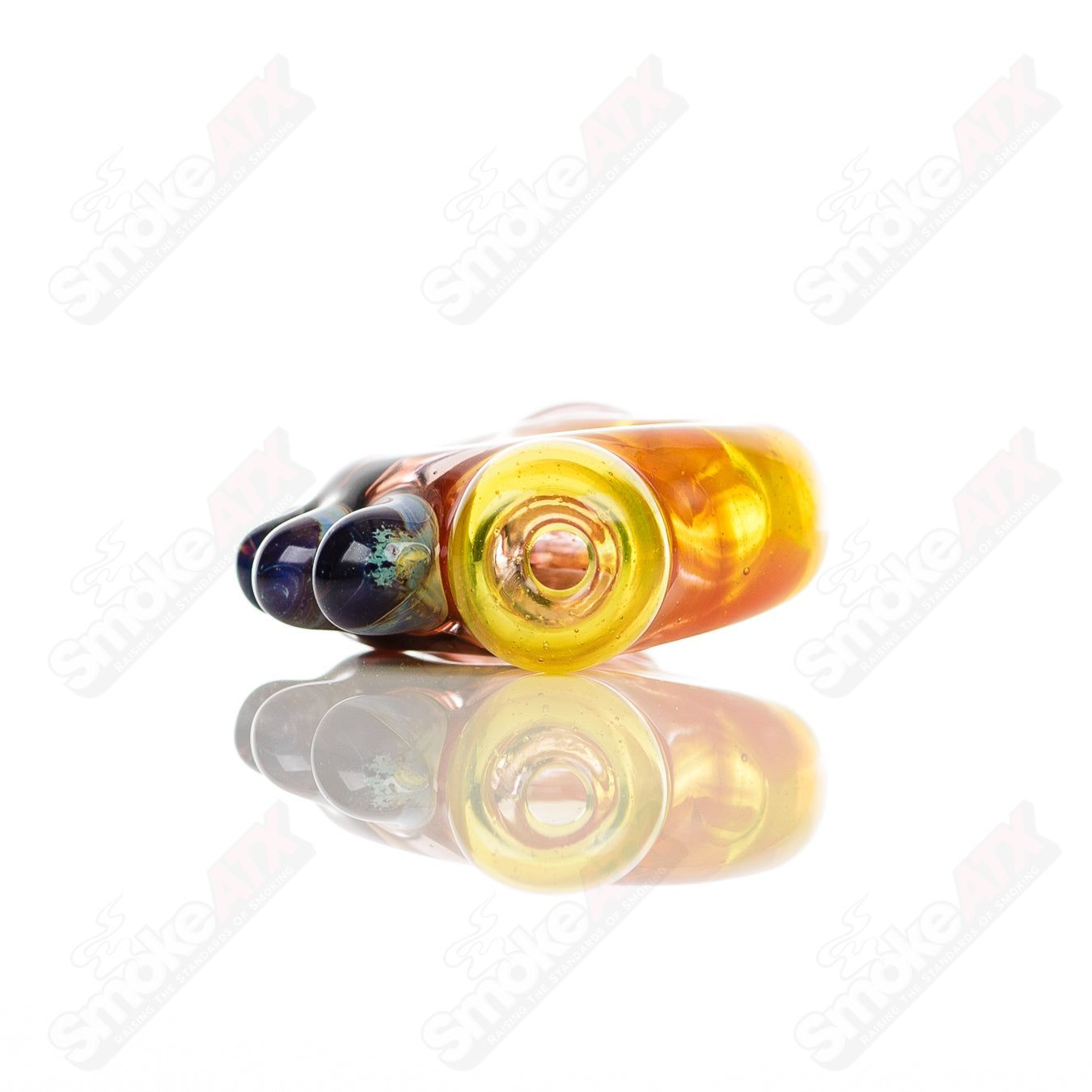 Large glass donut chillum by Baby Dabs, designed for baby dabs, featuring a colorful donut shape and sturdy glass construction.