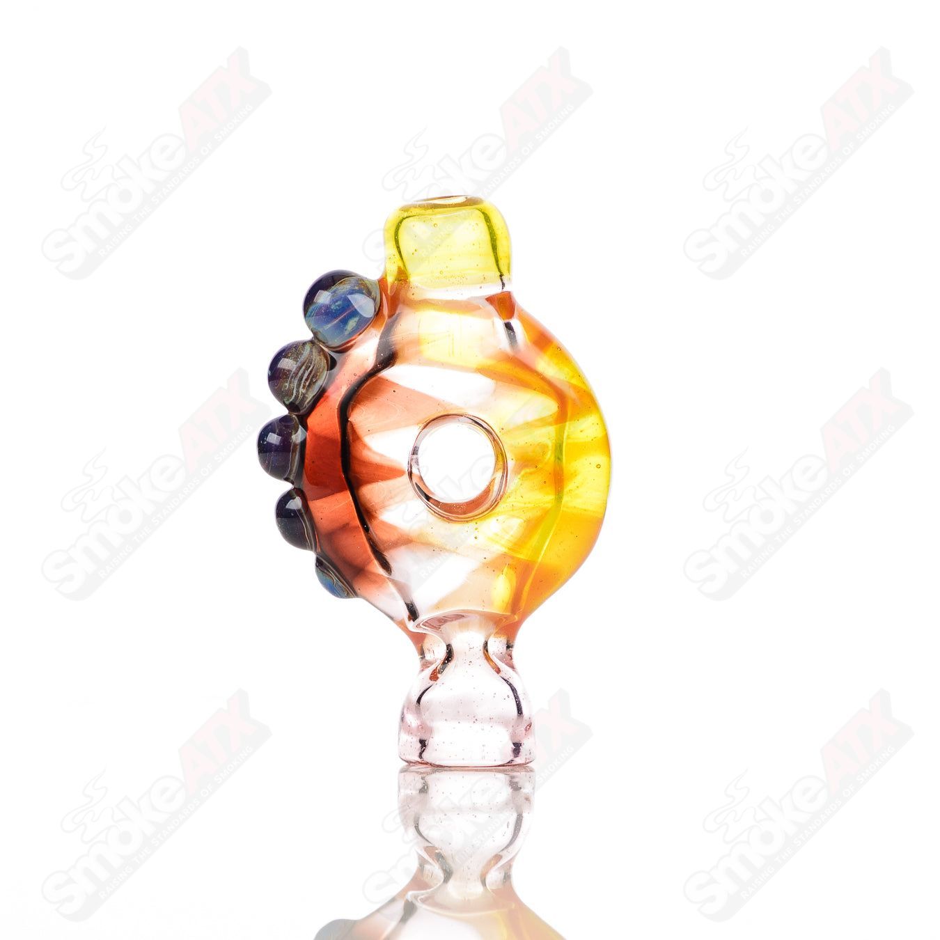 Large glass donut chillum by Baby Dabs, designed for baby dabs, featuring a colorful donut shape and smooth glass construction.