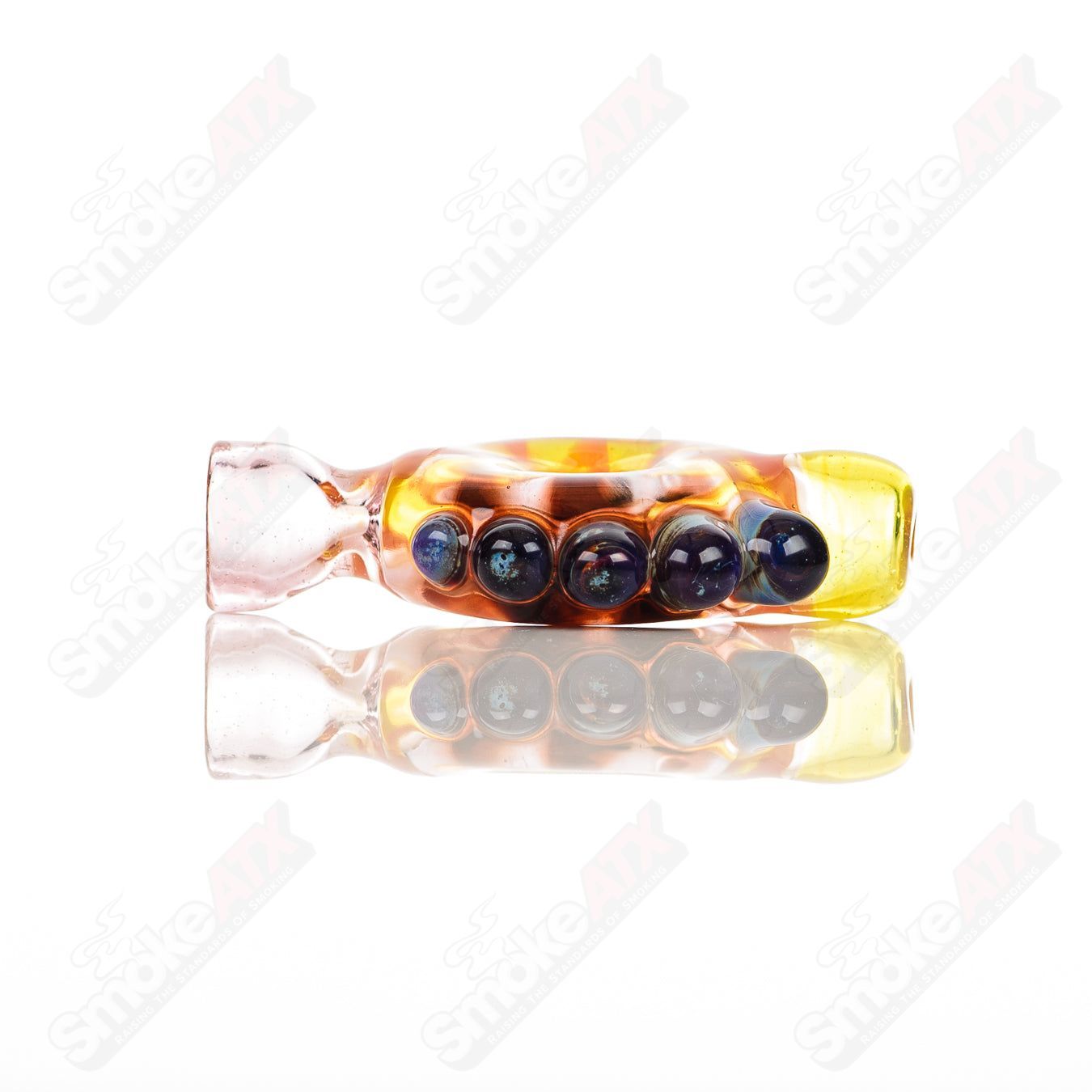Large glass donut chillum by Baby Dabs, designed for baby dabs, featuring a colorful donut shape and smooth glass construction.