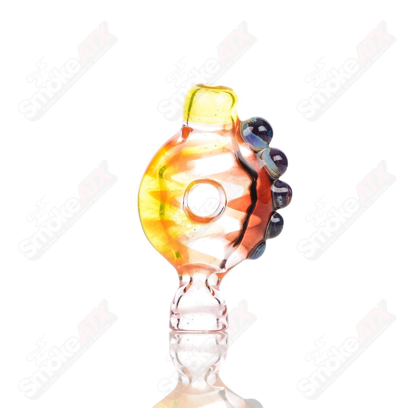 Large glass donut chillum by Baby Dabs, designed for baby dabs with a colorful donut-shaped mouthpiece and clear glass body.