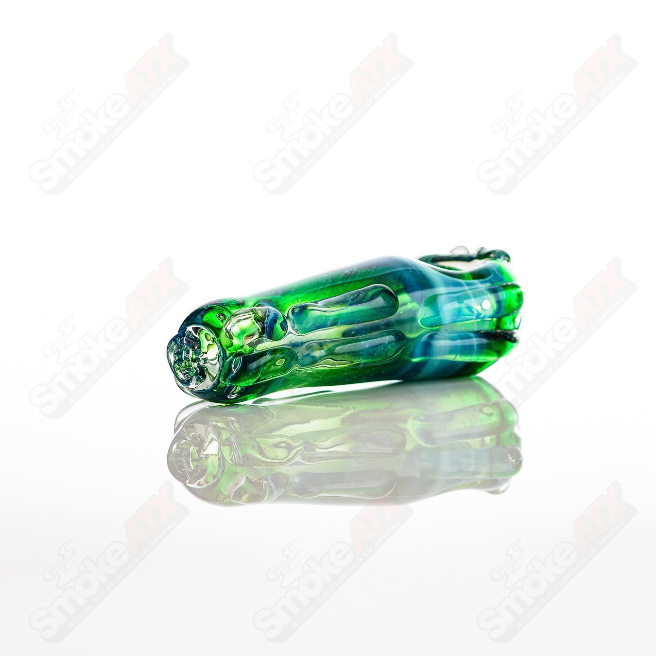 Glass pipe in a spoon shape by Nobody, featuring clear glass with a smooth bowl and stem design for smoking.