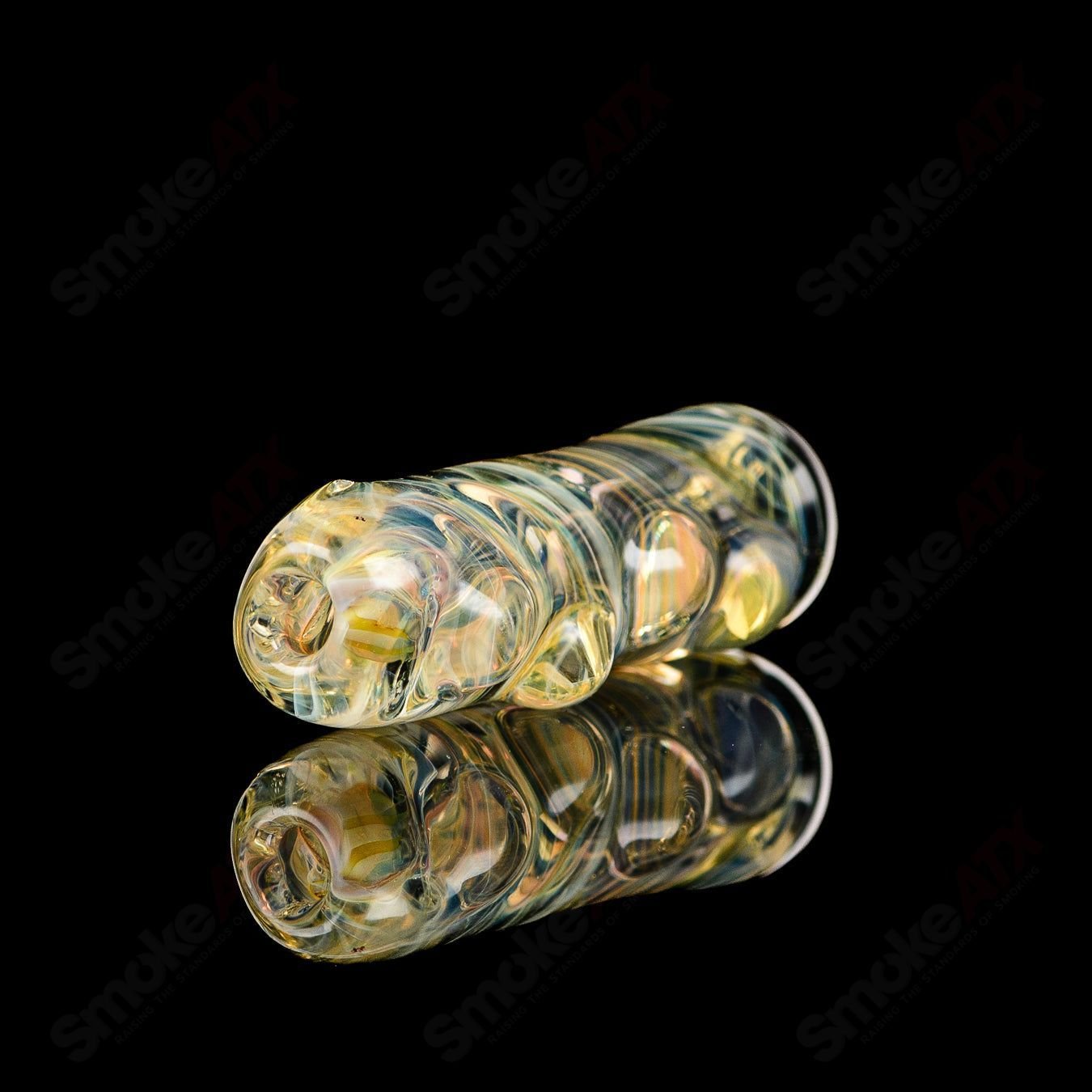 Clear Texas Hot Glass Taster Chillum with a smooth, cylindrical design for easy grip and use.