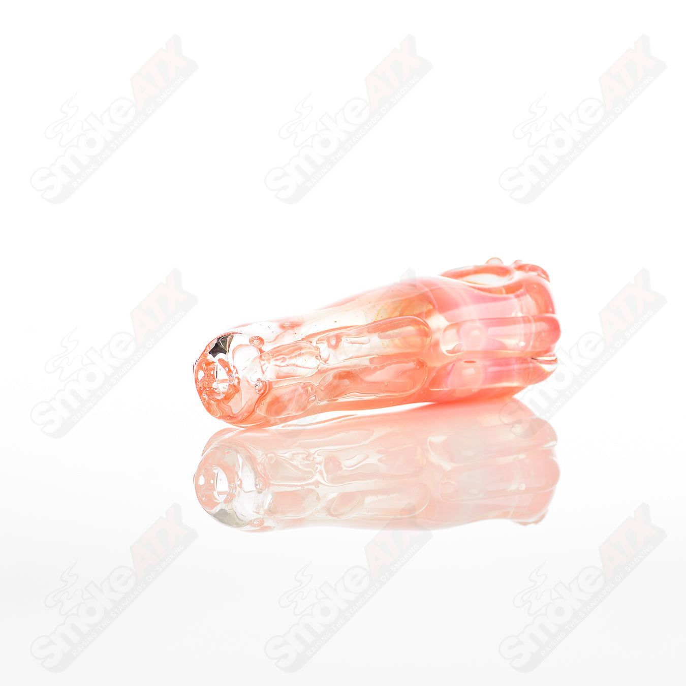 Clear glass spoon pipe by Nobody, featuring a smooth, rounded bowl and elongated stem for easy handling and use.