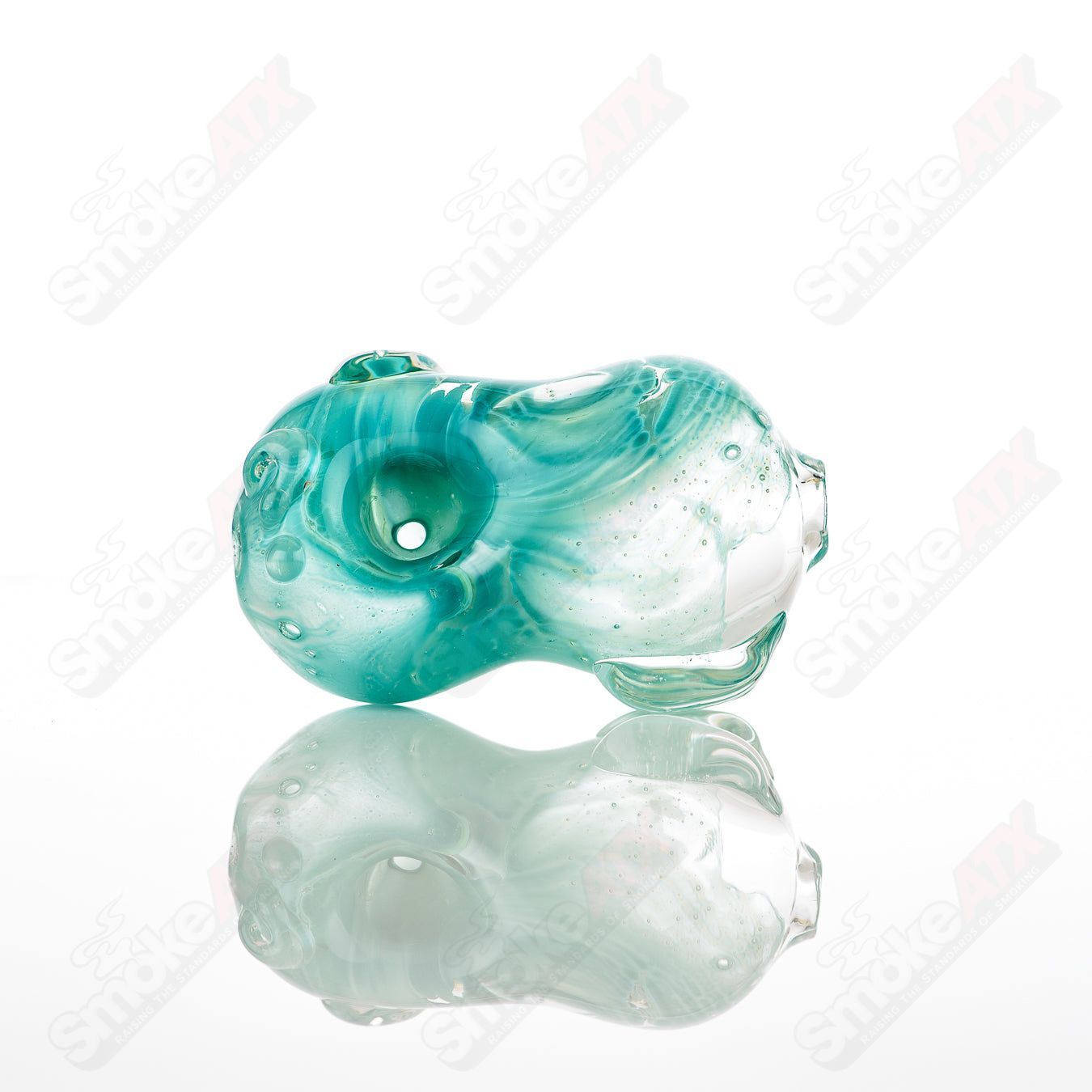 Glass pipe called #8 Bean Spoon by Nobody, clear glass with a bean-shaped bowl and smooth cylindrical stem.