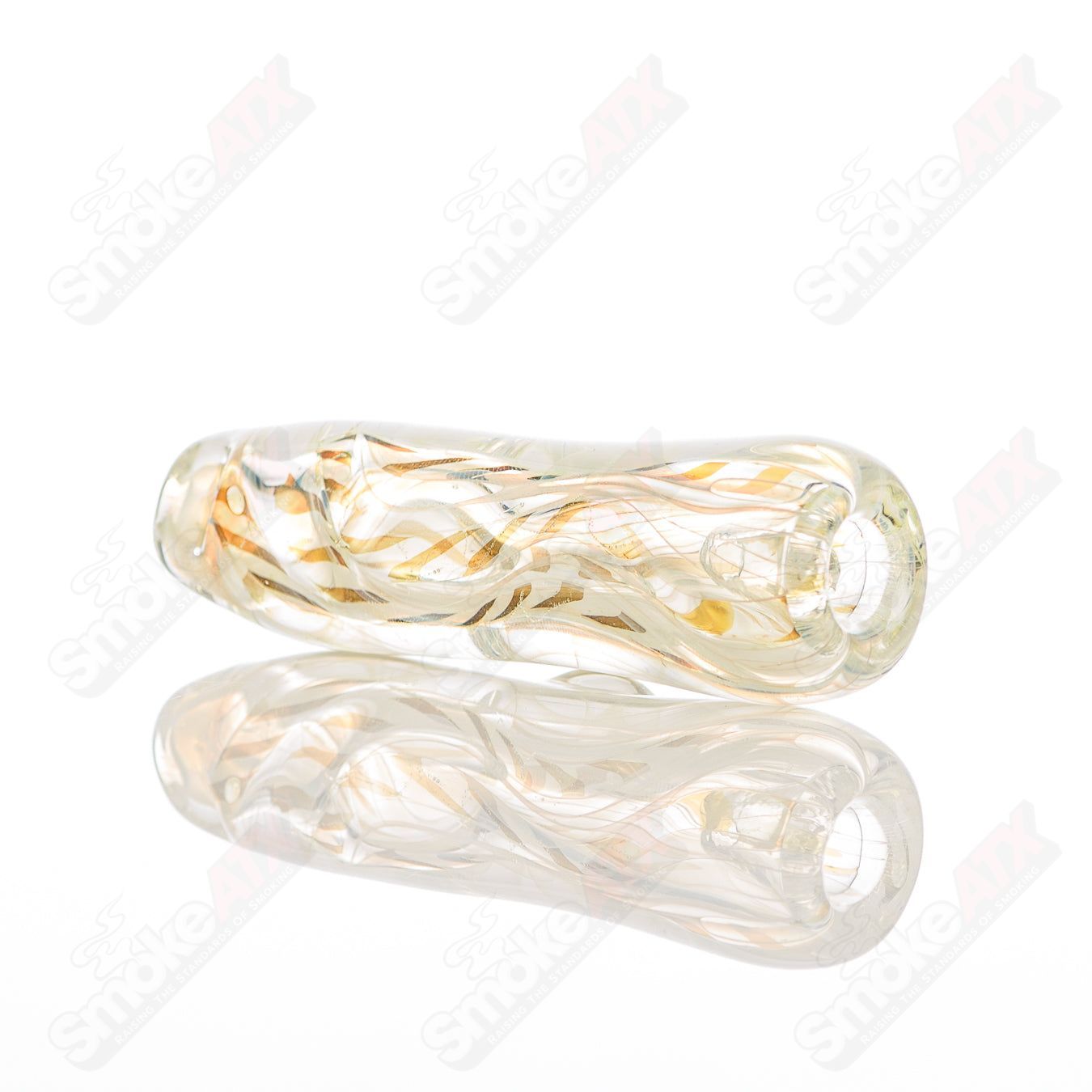 Close-up of Texas Hot Glass #8 Taster Chillum, a clear glass smoking pipe with a smooth, cylindrical design.