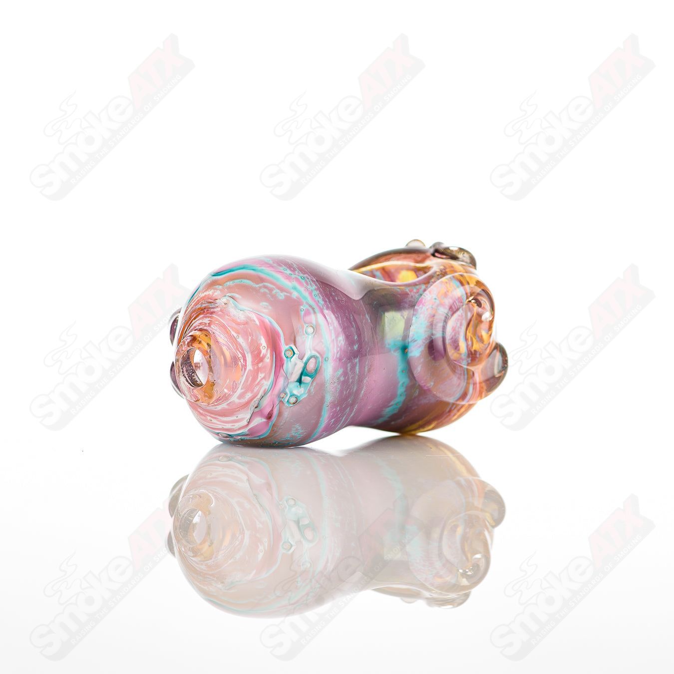 Glass pipe called #9 Bean Spoon by Nobody, clear glass with bean-shaped design, used for smoking, detailed close-up image.