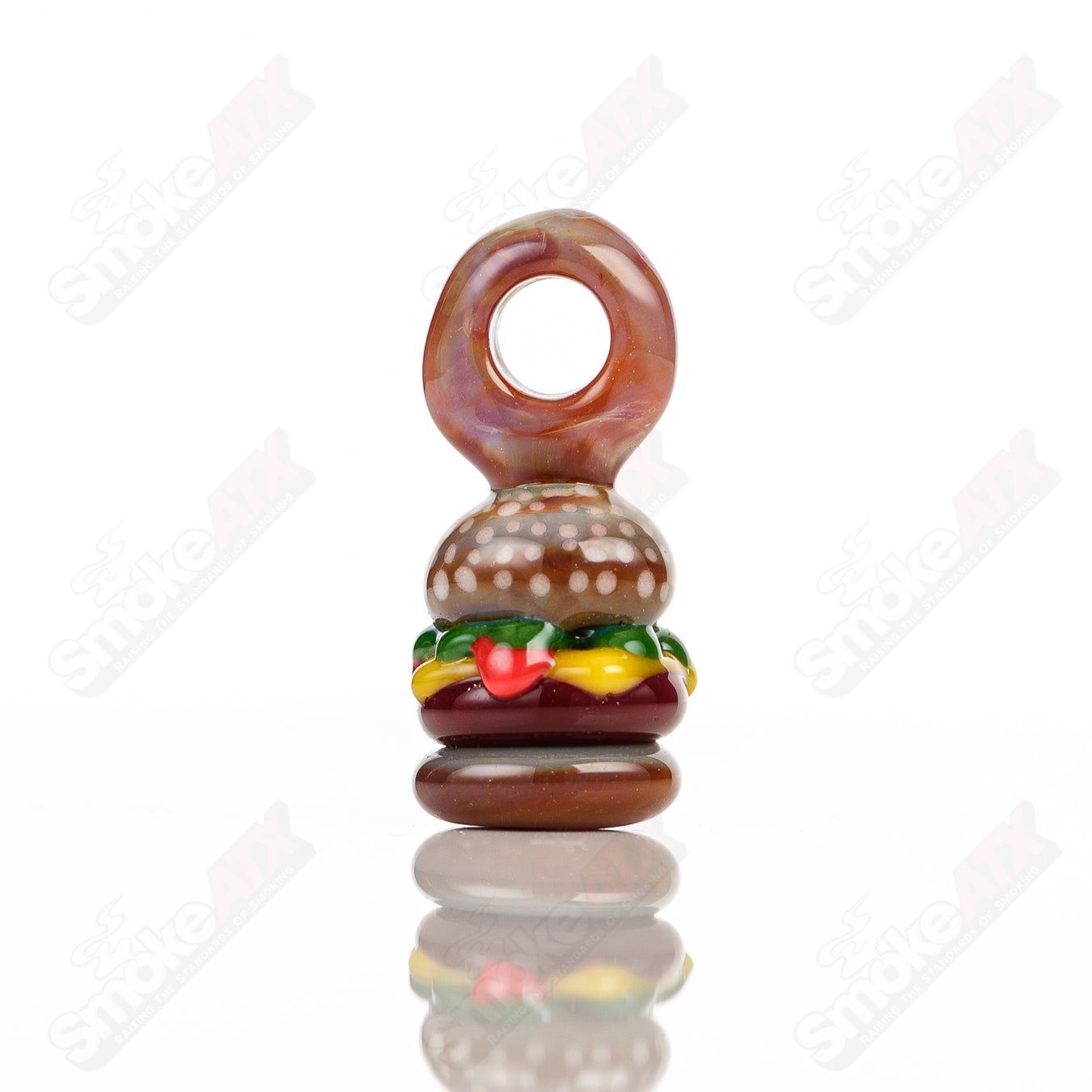 Sputnik glass burger pendant, a decorative jewelry piece featuring a detailed glass burger charm on a chain.