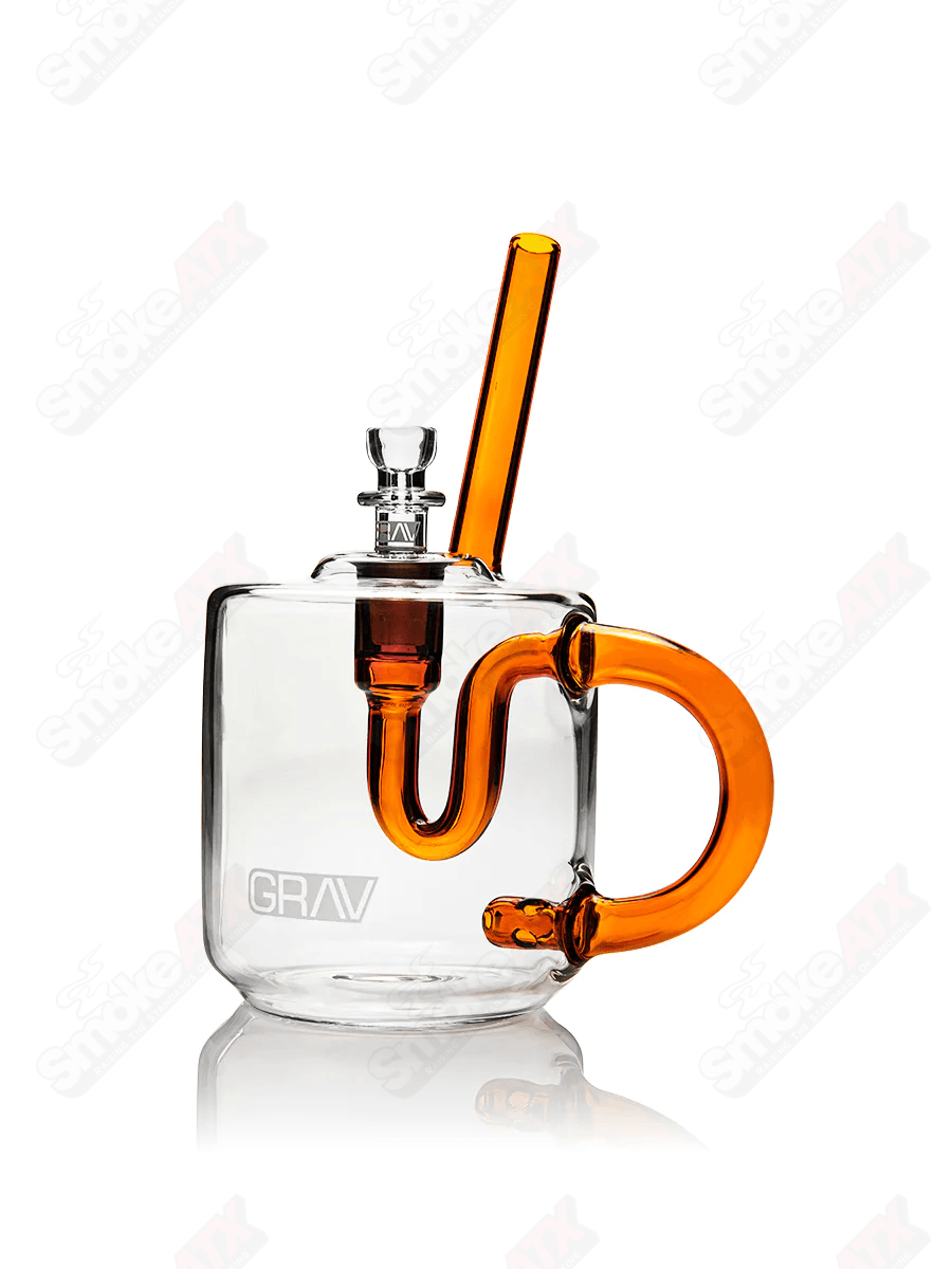Clear amber green Grav glass coffee mug water pipe with intricate design, showcasing its transparent and colorful glass craftsmanship.