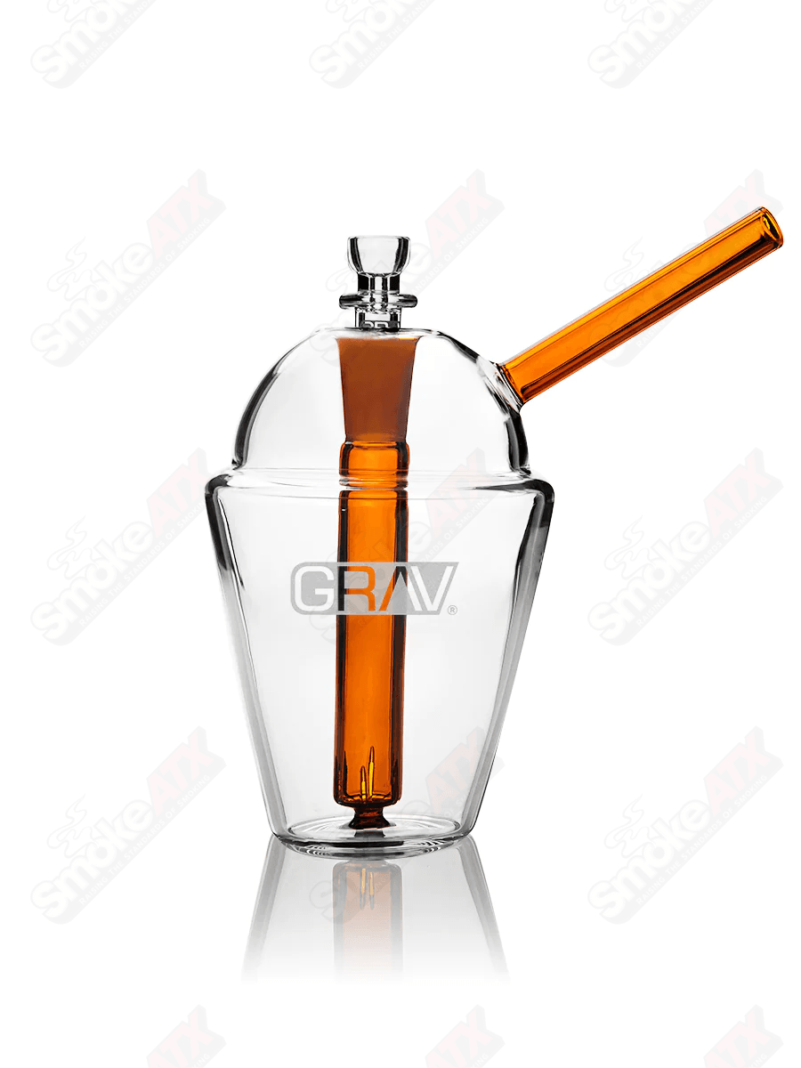 Clear and amber glass slush cup bubbler waterpipe by Grav, featuring a stylish design and functional mouthpiece.