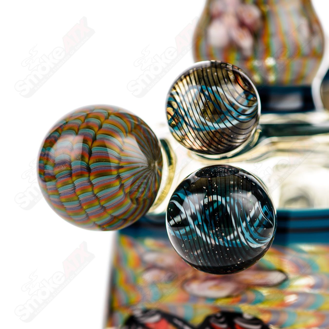 Coiled Latticello Milli Rig by Conversion Glass, a heady concentrate rig with intricate glasswork and colorful accents.