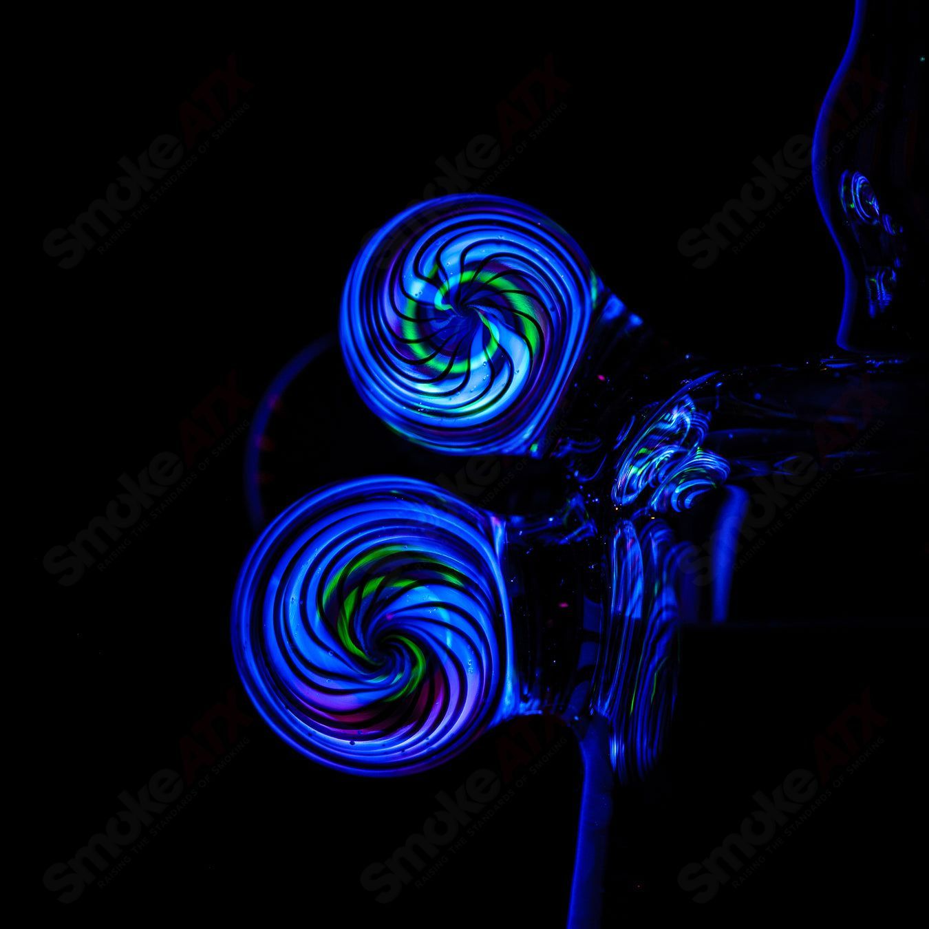 Coiled Latticello Milli Rig by Conversion Glass, a colorful heady concentrate rig with intricate glasswork and coiled design.