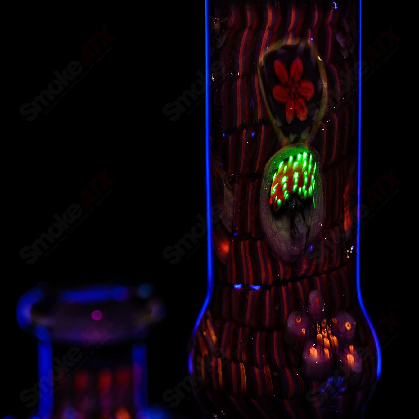 Coiled Latticello Milli Rig by Conversion Glass, a colorful heady glass concentrate rig with intricate lattice design and glass accents.