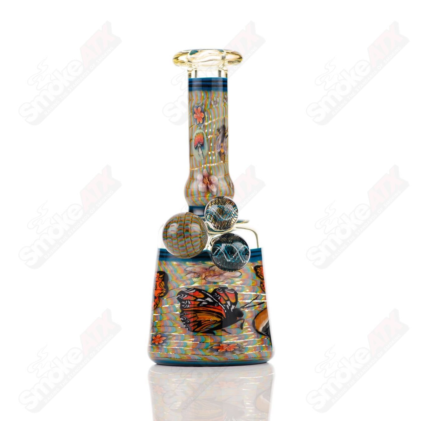 Coiled Latticello Milli Rig by Conversion Glass, a heady concentrate rig with intricate glasswork and vibrant colors.