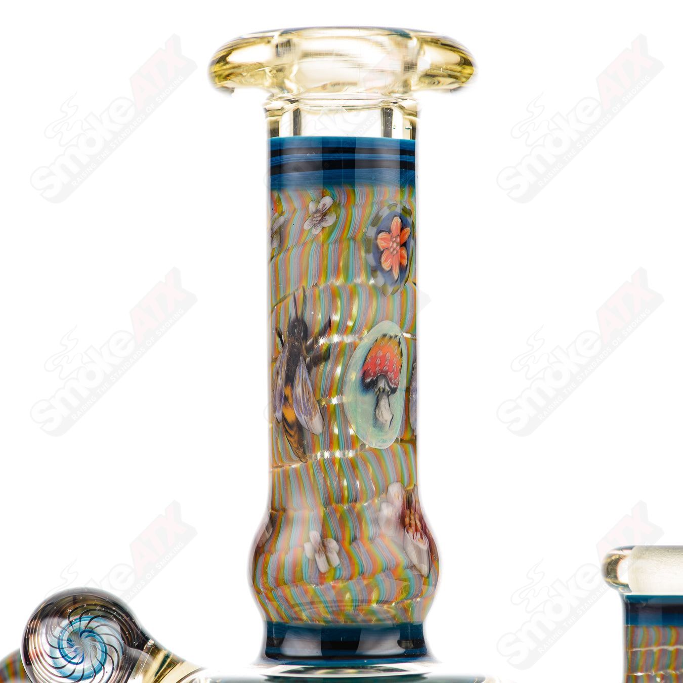 Coiled Latticello Milli Rig by Conversion Glass, a colorful heady glass concentrate rig with intricate coil design and artistic details.