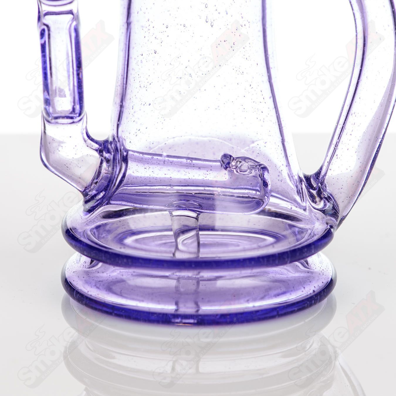 Colored Bubble Dumper Reed Glass concentrate rig with vibrant glass design, featuring a unique bubble pattern and clear glass accents.