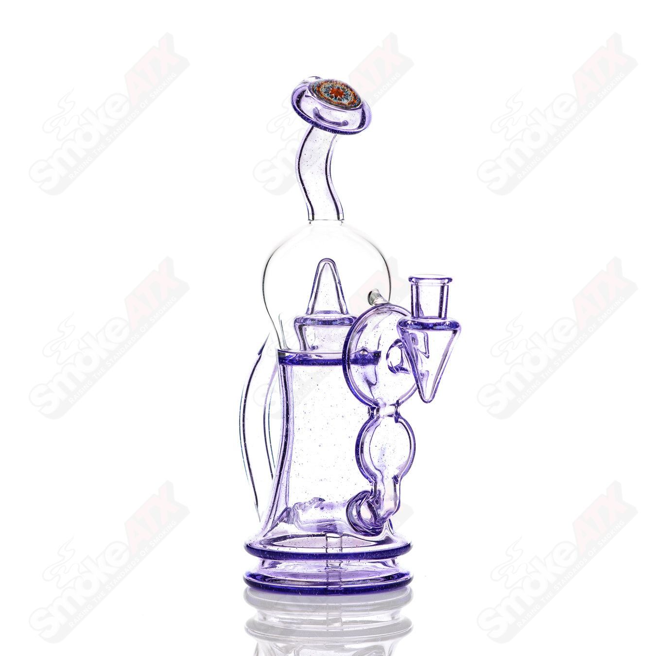 Colorful Bubble Dumper Reed Glass concentrate rig with vibrant bubble designs, made by Reed Glass.