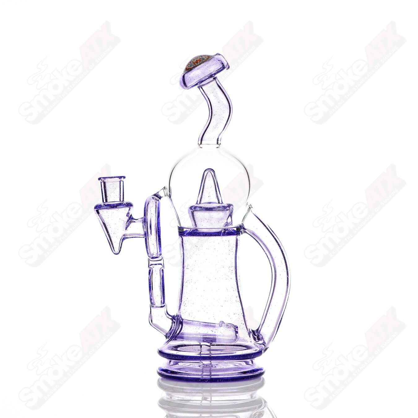 Colored Bubble Dumper Reed Glass concentrate rig with vibrant bubble design, crafted by Reed Glass in clear and colorful glass.