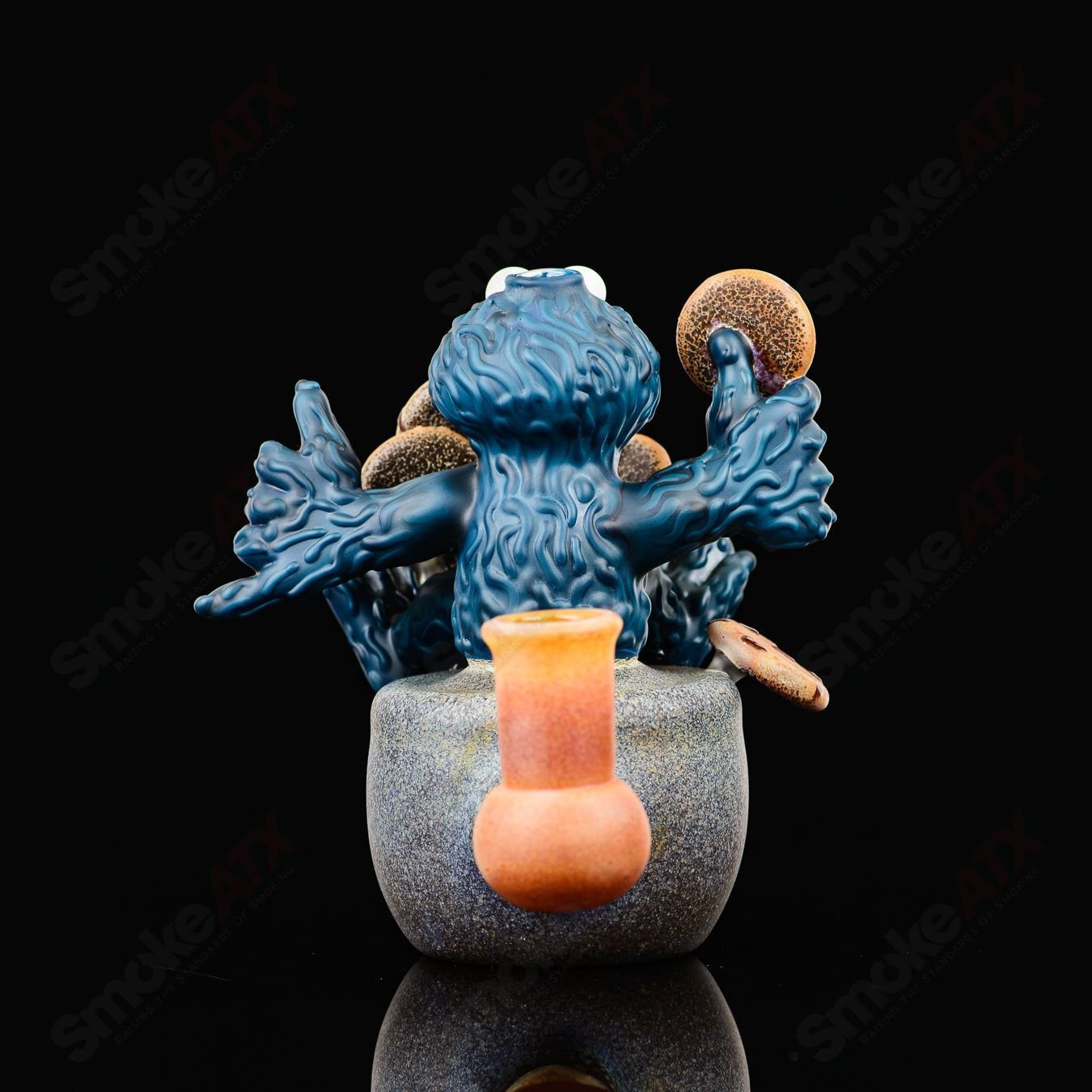 Colorful Cookie Monster Morrison glass heady concentrate rig by Robert Morrison with intricate glasswork and playful design.