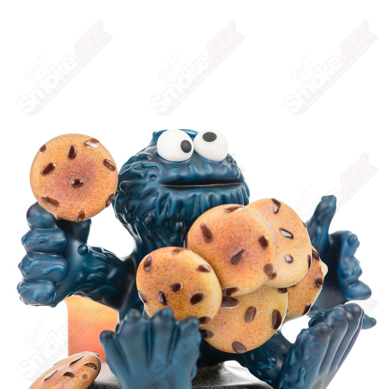 Colorful Cookie Monster Morrison Glass concentrate rig by Robert Morrison, featuring detailed cartoon character design.