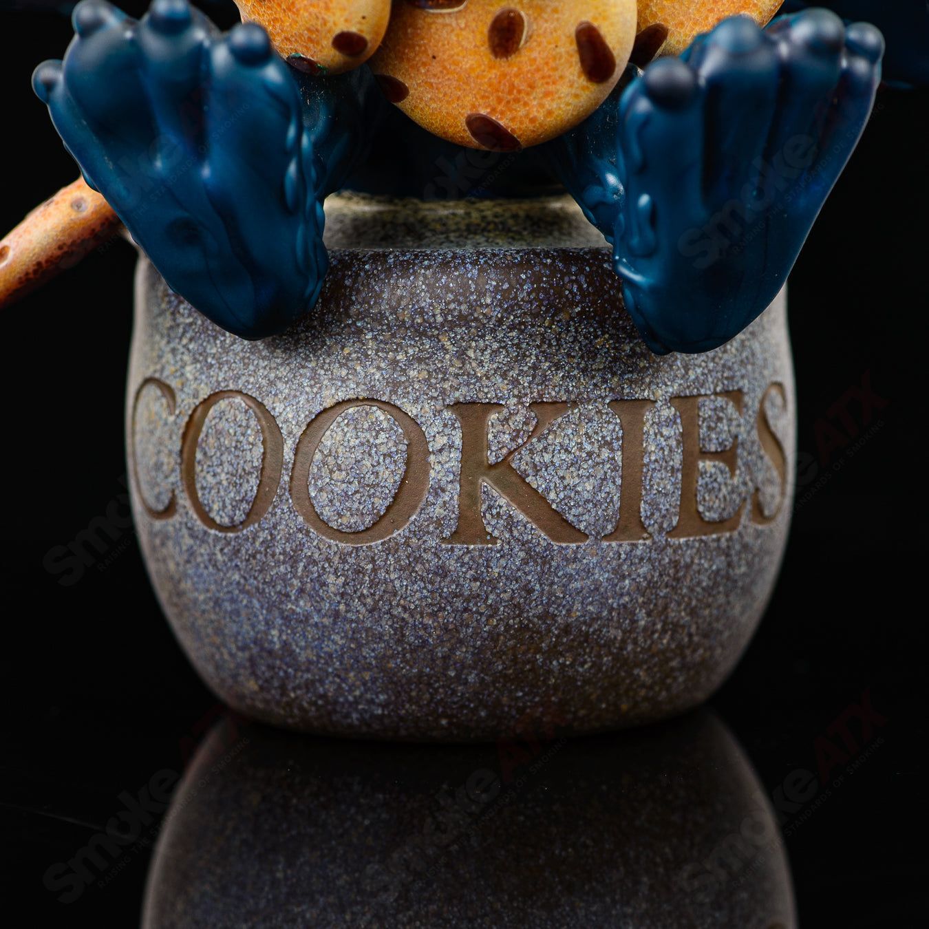 Colorful Cookie Monster Morrison glass concentrate rig by Robert Morrison featuring a detailed Cookie Monster face design.