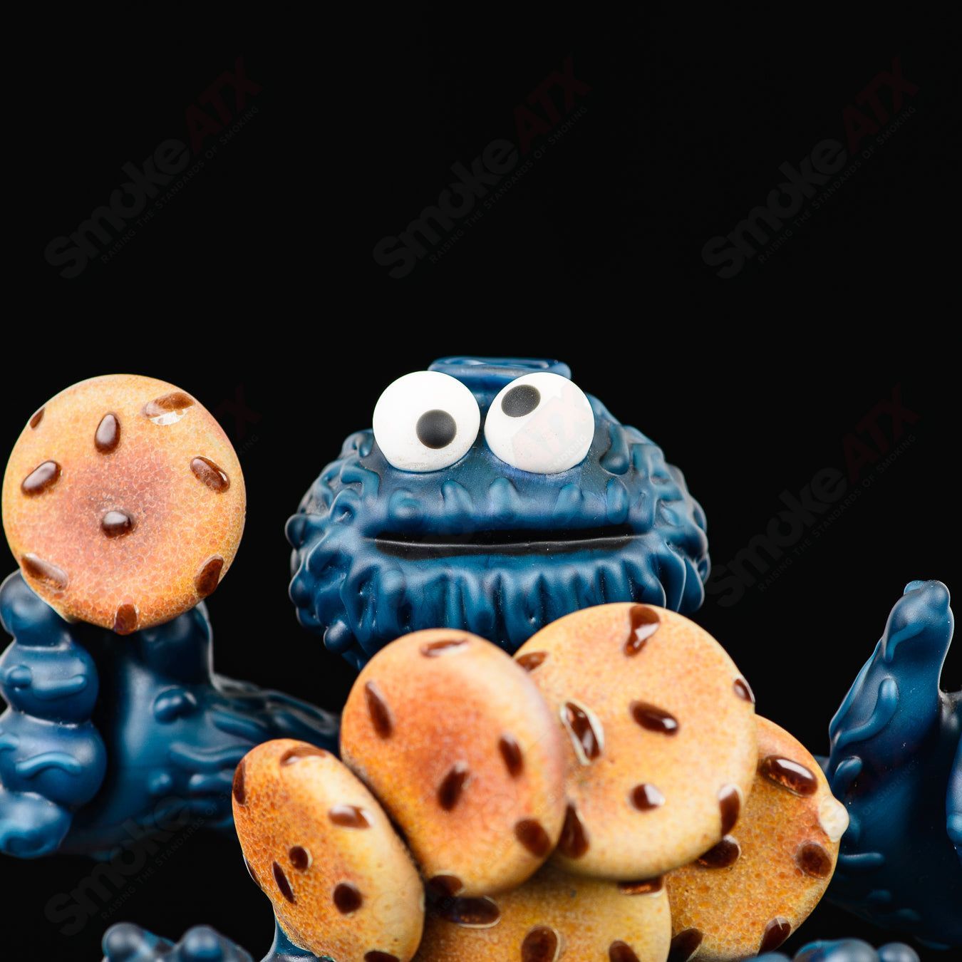 Colorful Cookie Monster Morrison Glass heady concentrate rig by Robert Morrison with detailed cartoon character design.