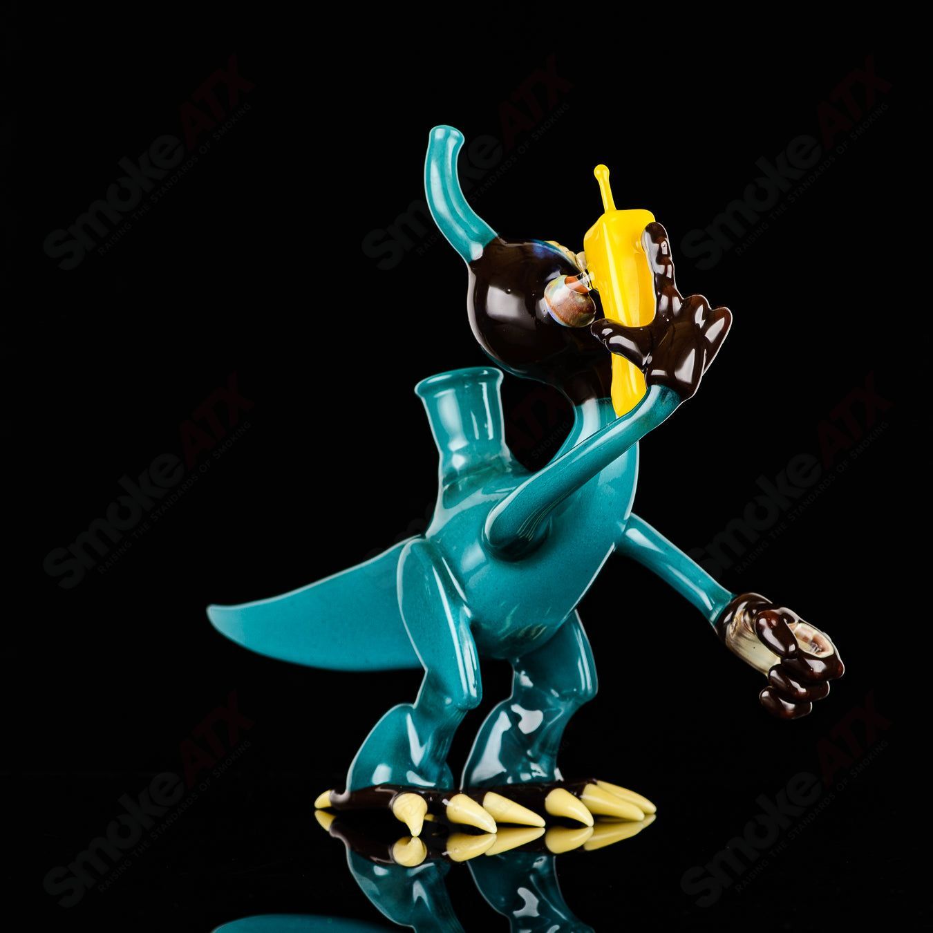 Elbo Glass Coyle x Elbo Dino Monkey heady glass concentrate rig with detailed dino and monkey design in vibrant colors.